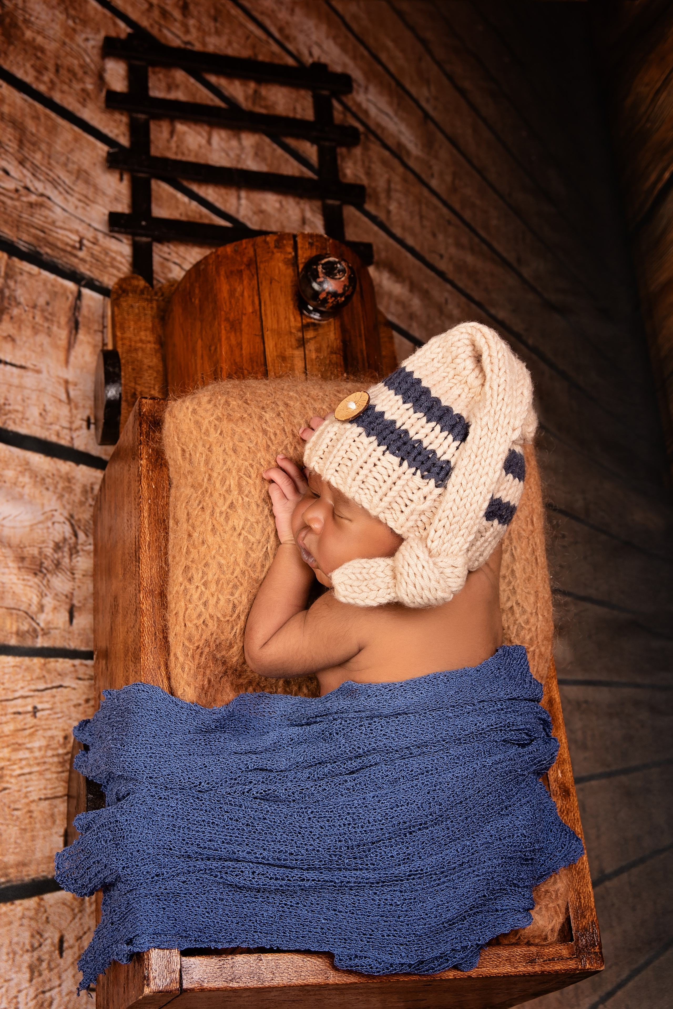 African newborn baby boy in wooden train photo shoot Eldoret Kenya
