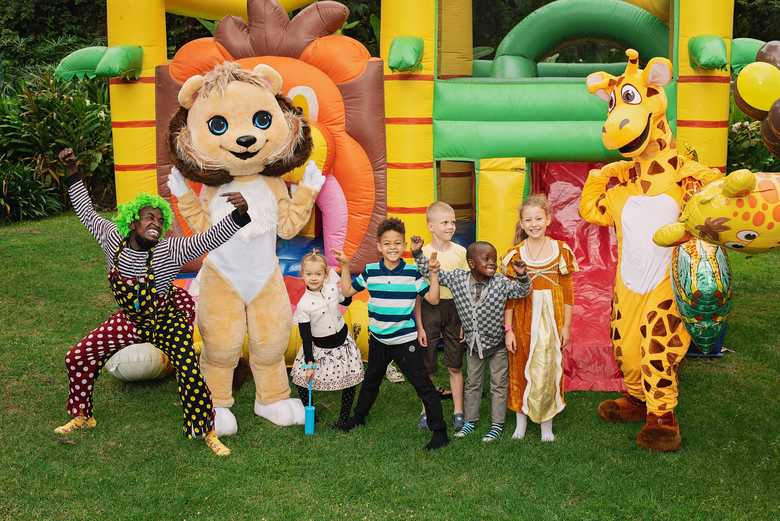 Birthday party 8 years boys and girls photo shoot pictures  with clown near bouncing castle