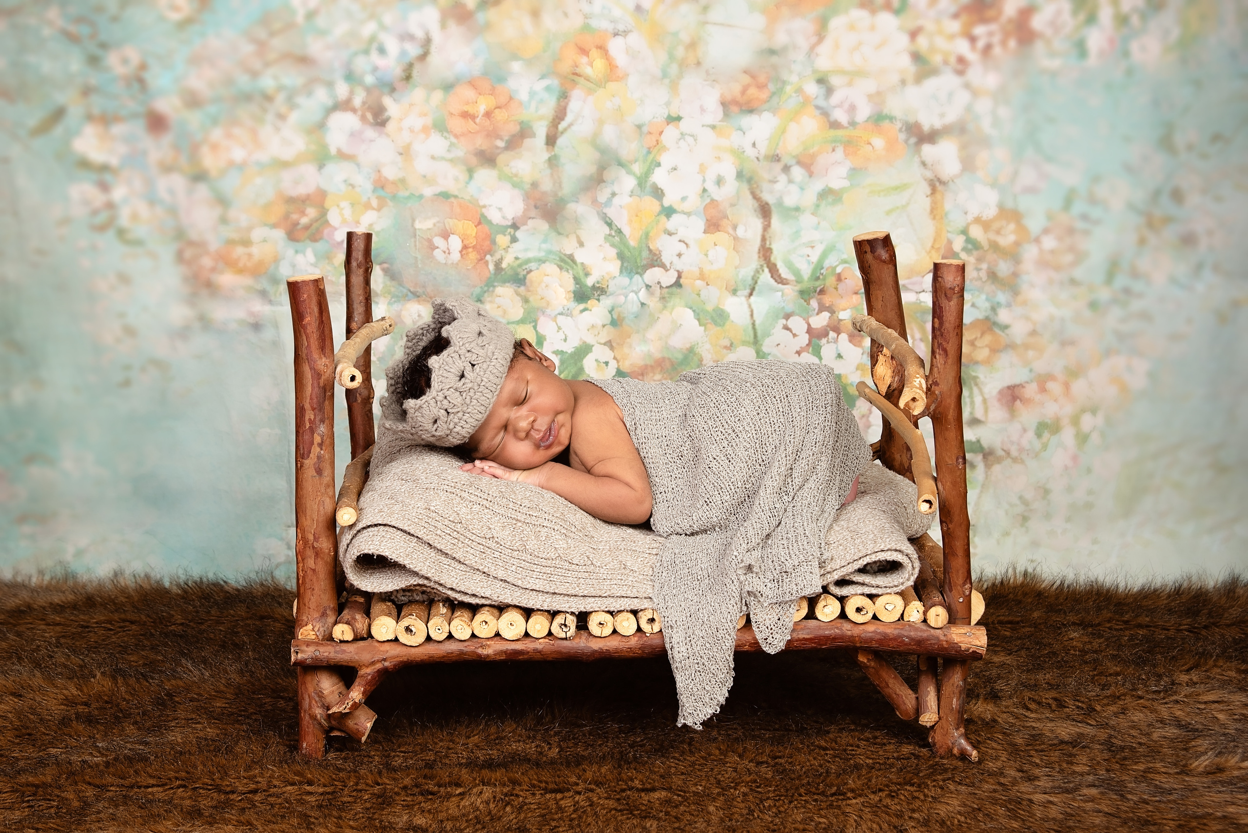 Black newborn baby boy in bed photo shoot Nairobi Kenya