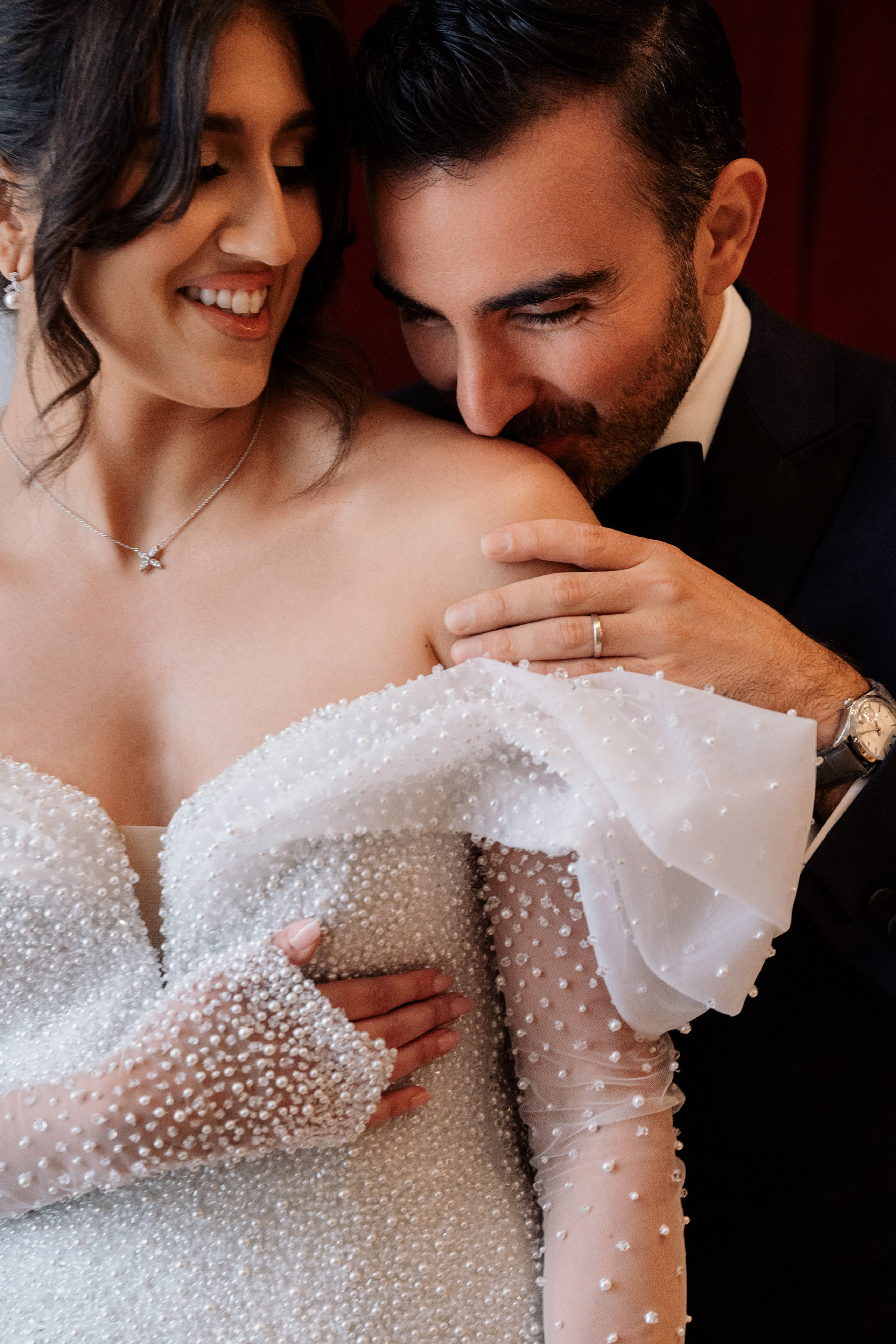 a man and woman are posing for a picture