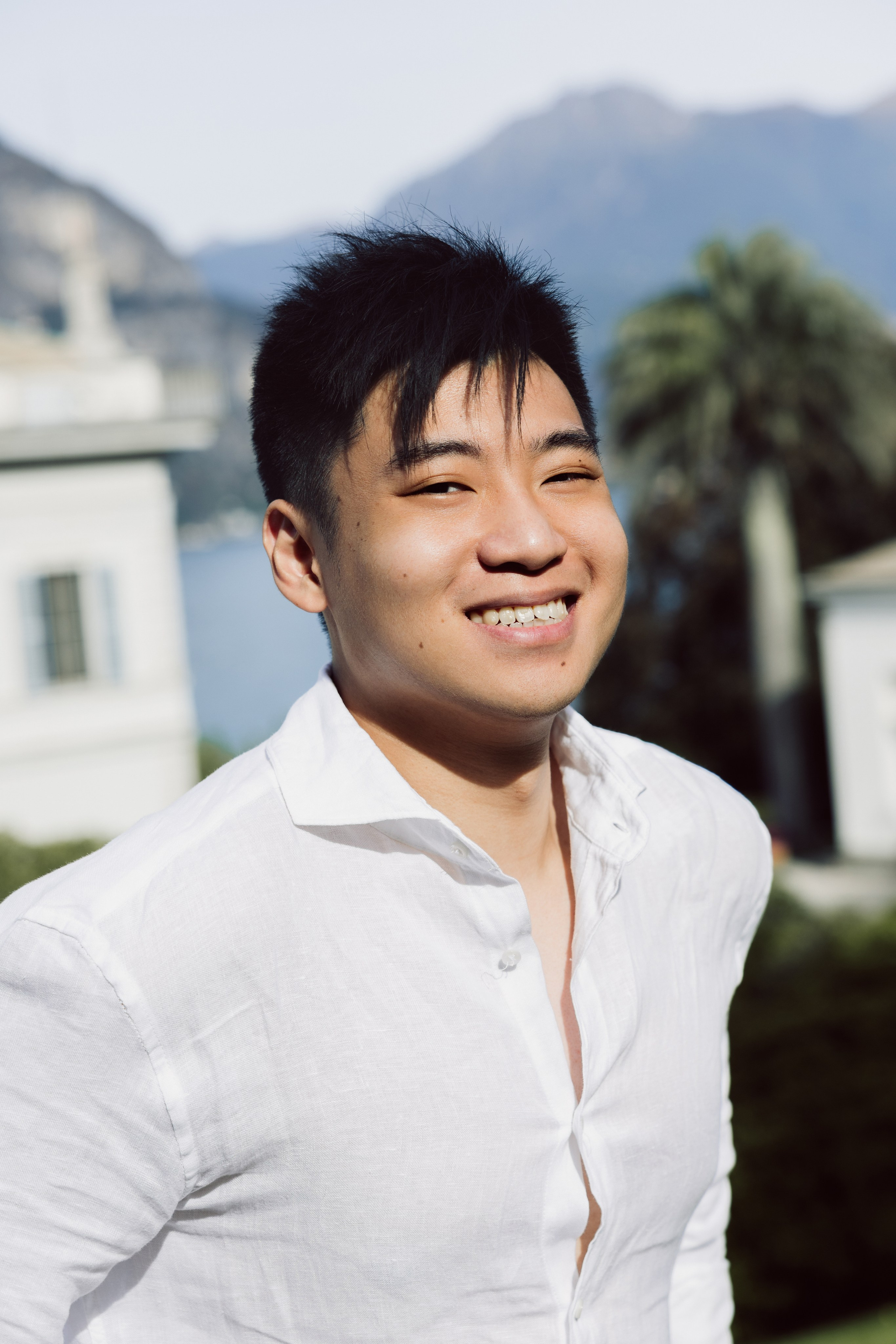 Smiling portrait of a man during a romantic couple photoshoot at Lake Como