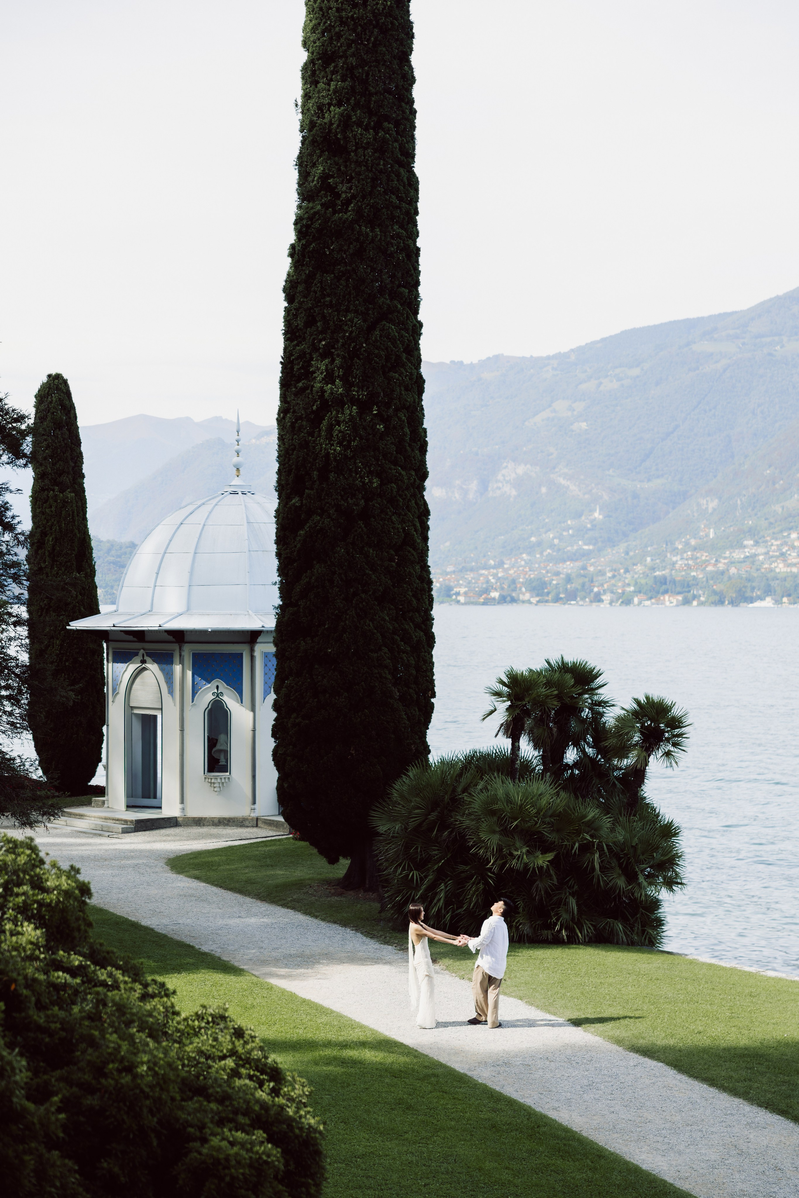 Scenic garden path and lakeside pavilion at Villa Melzi in Bellagio