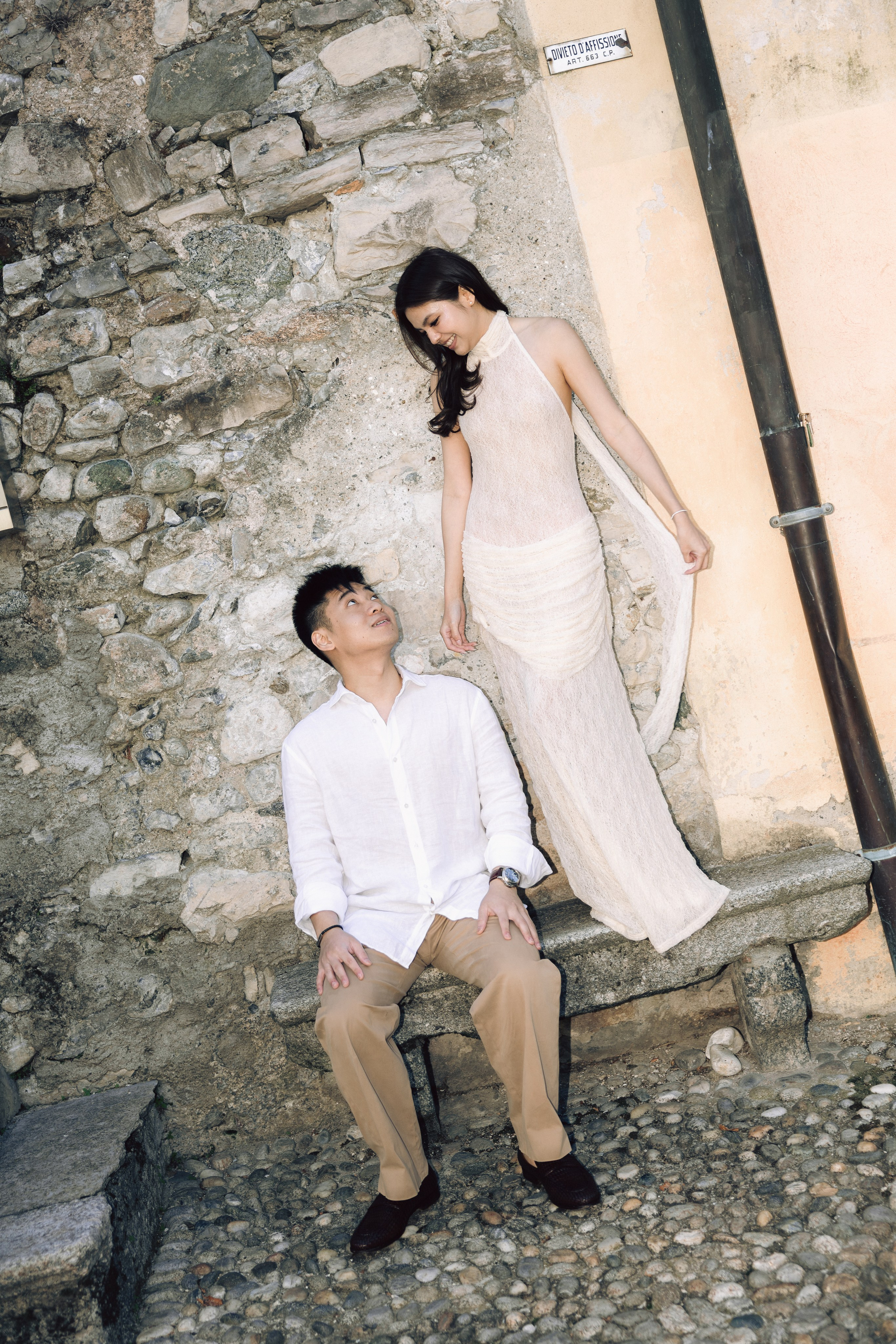 Romantic couple portrait on rustic stone steps during a Lake Como engagement session