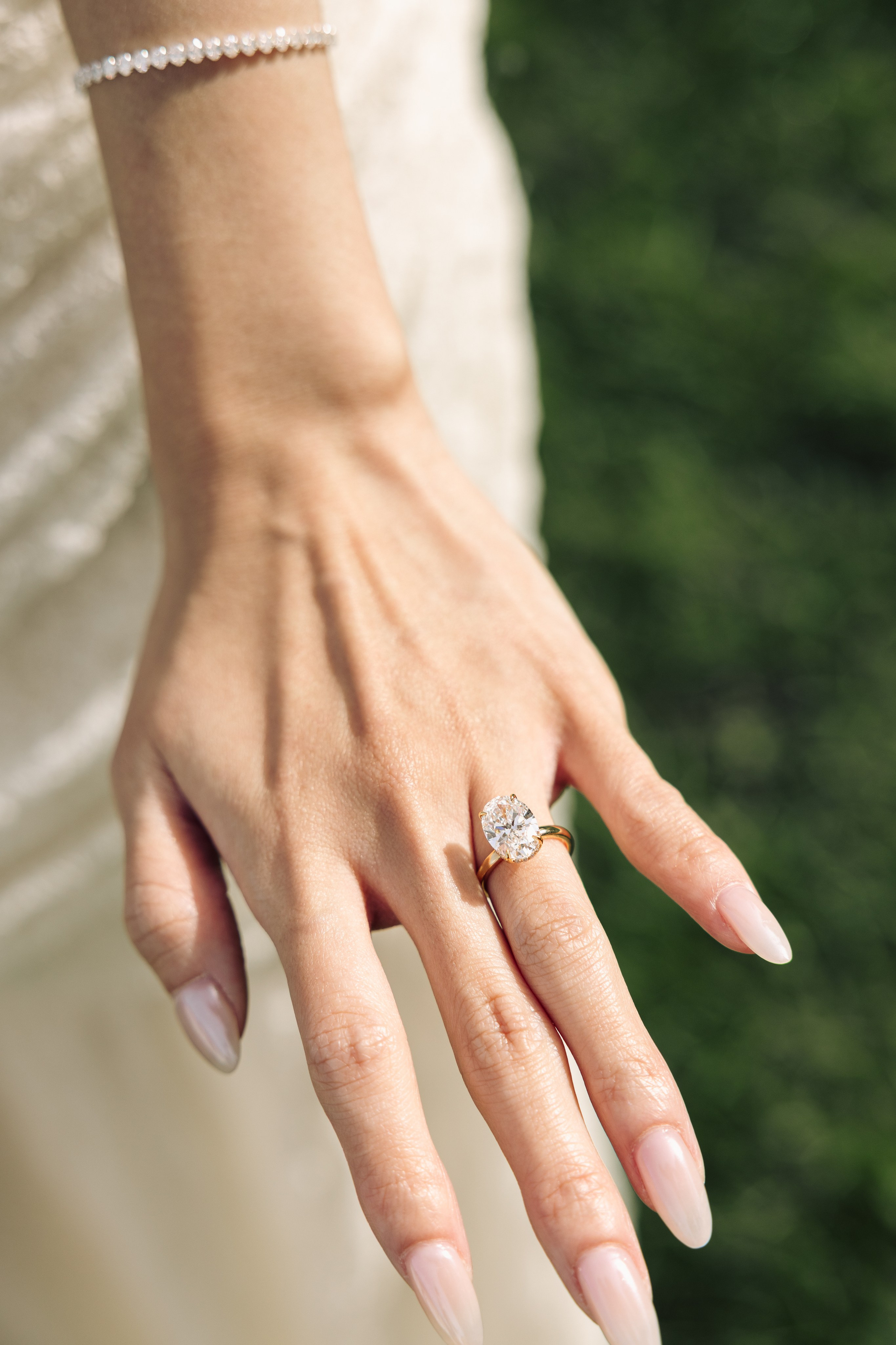 Close-up of a diamond engagement ring after a surprise proposal on Lake Como