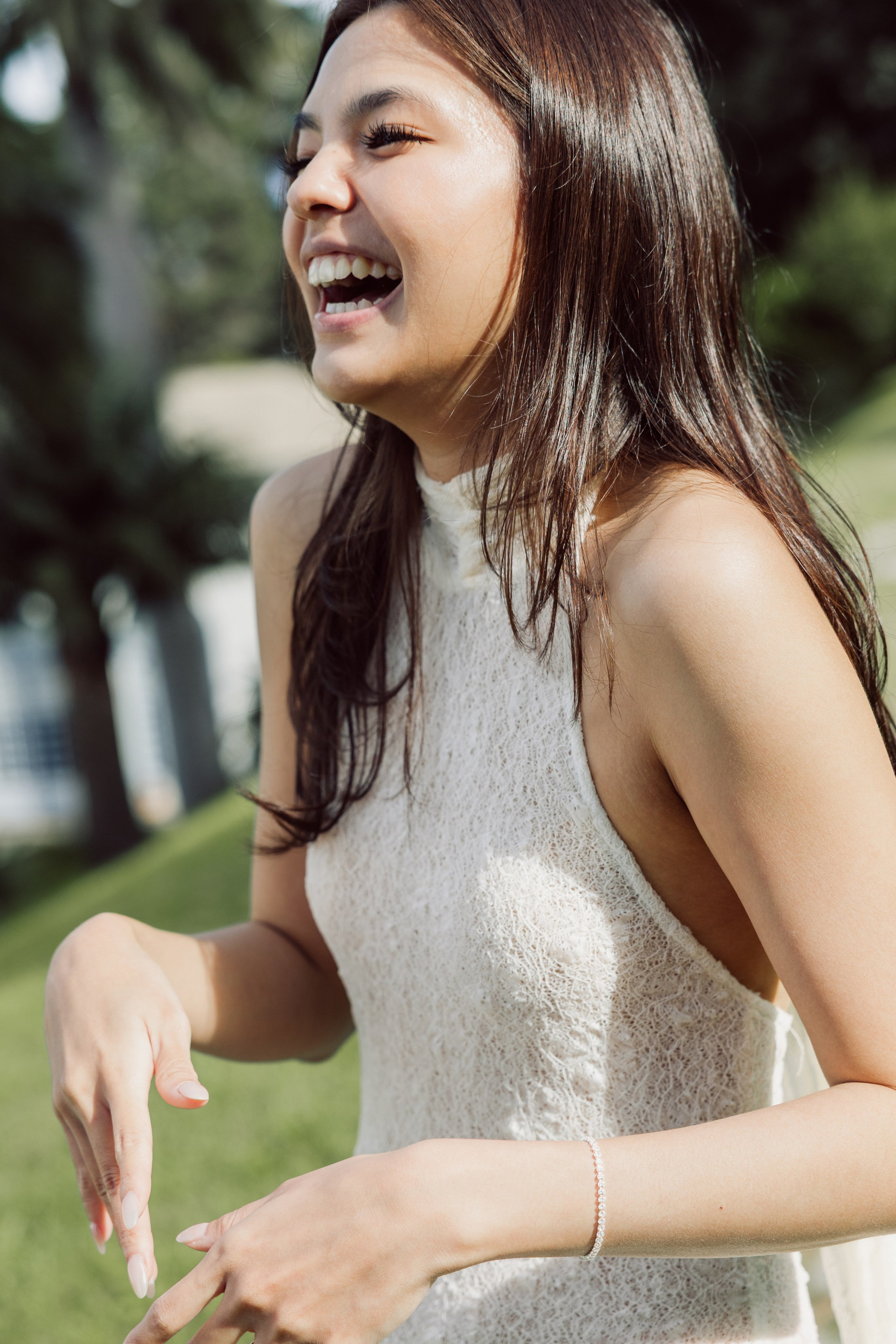 Woman laughing joyfully during a romantic engagement photoshoot in Bellagio