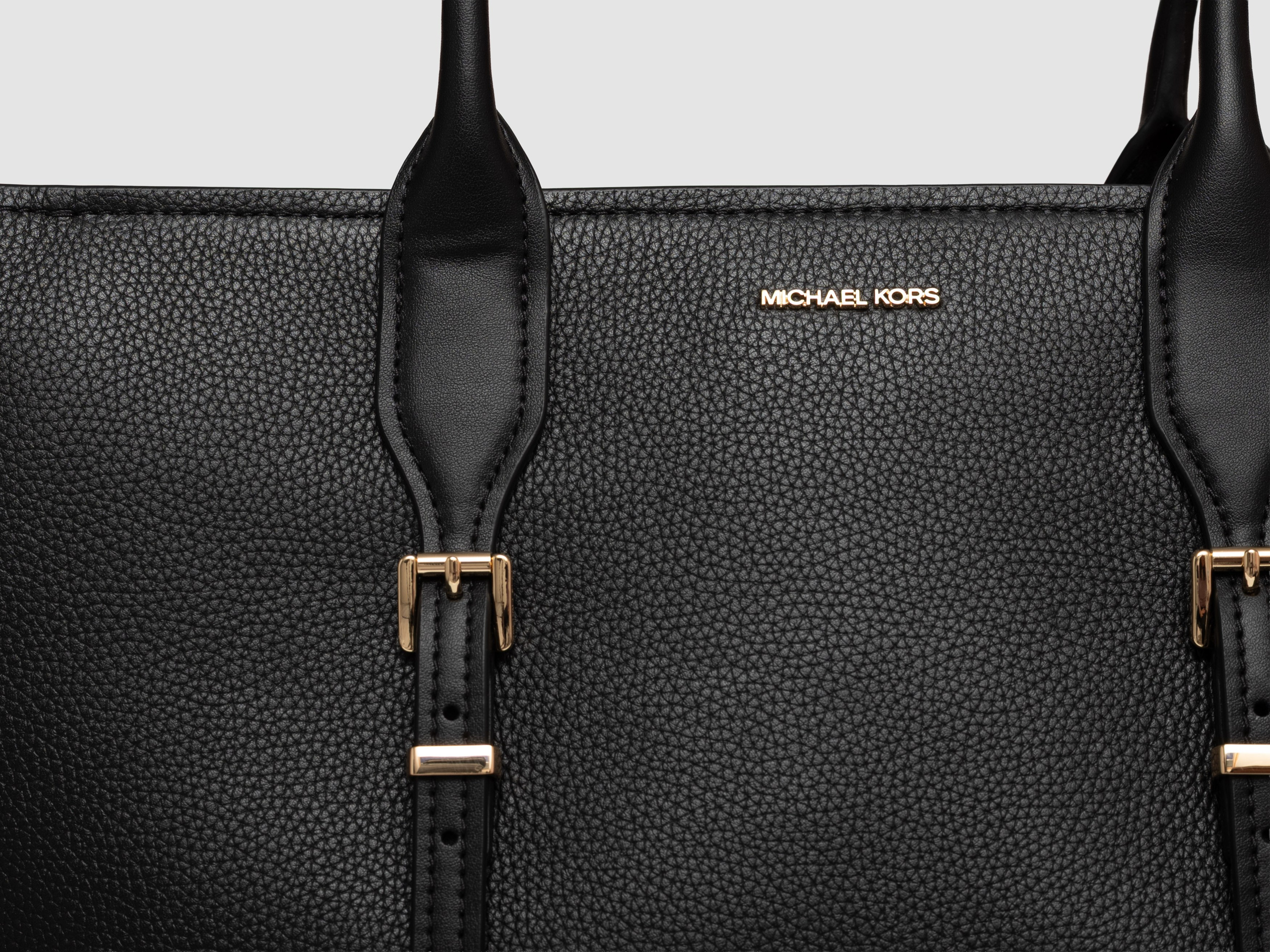 Black tote bag detail top view white background interior photography