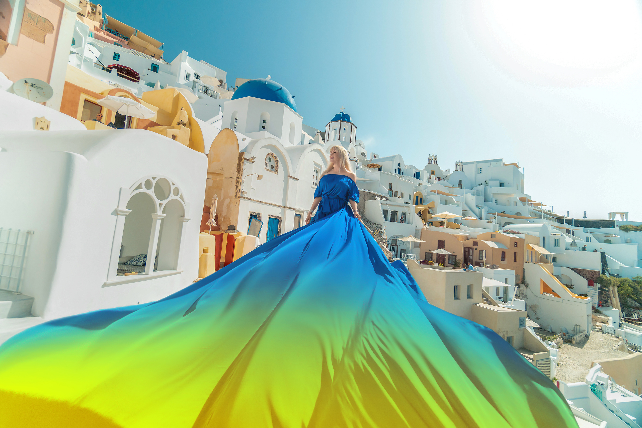 Photo session in Oia, Santorini in the morning. Photographer in Santorini SokoLOVE Alex| Flying Dress Santorini