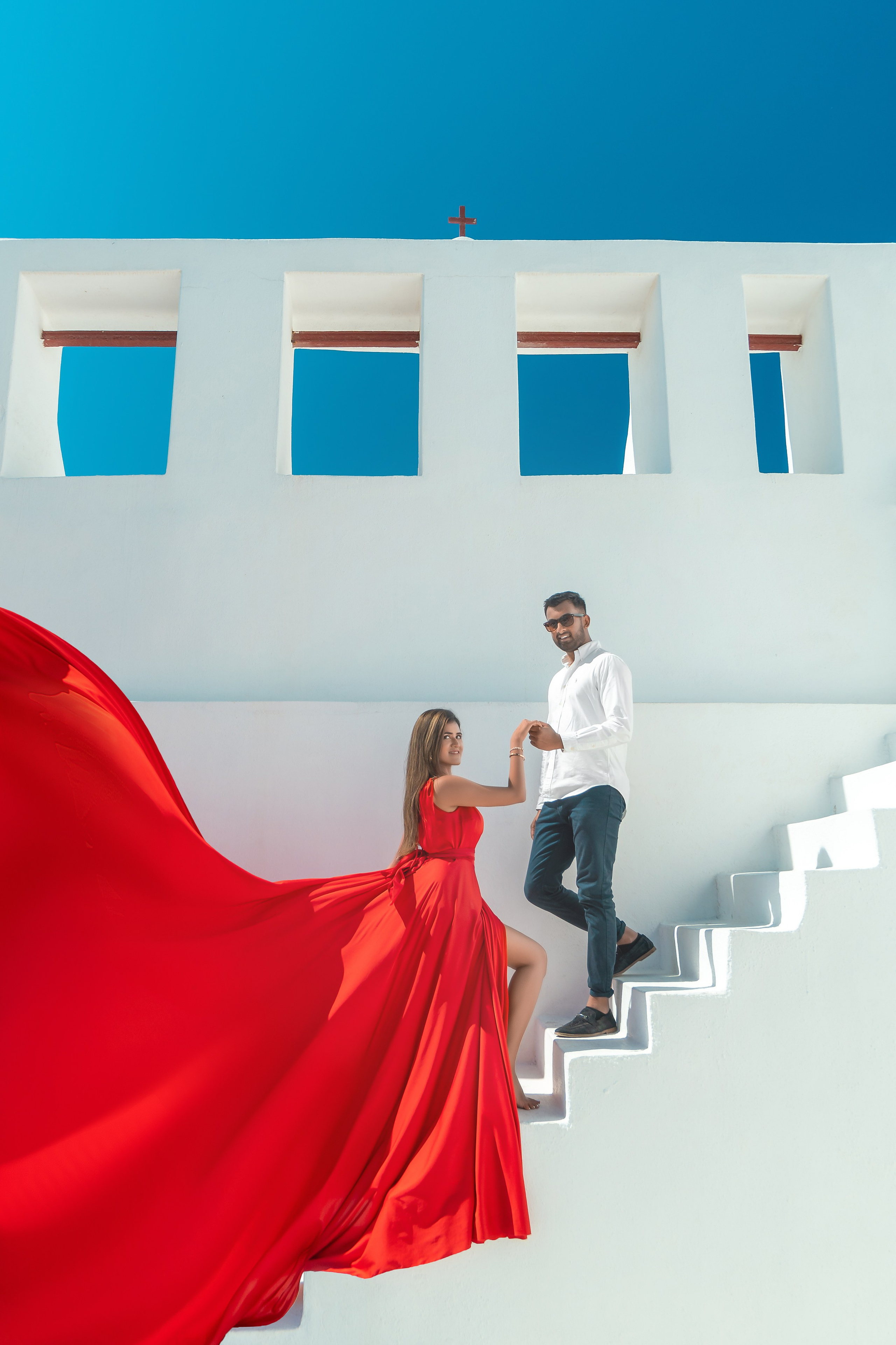Santorini’s Magic in Motion: Flying Dress Photoshoot with a Lovely Couple from India. Photographer in Santorini SokoLOVE Alex| Flying Dress Santorini