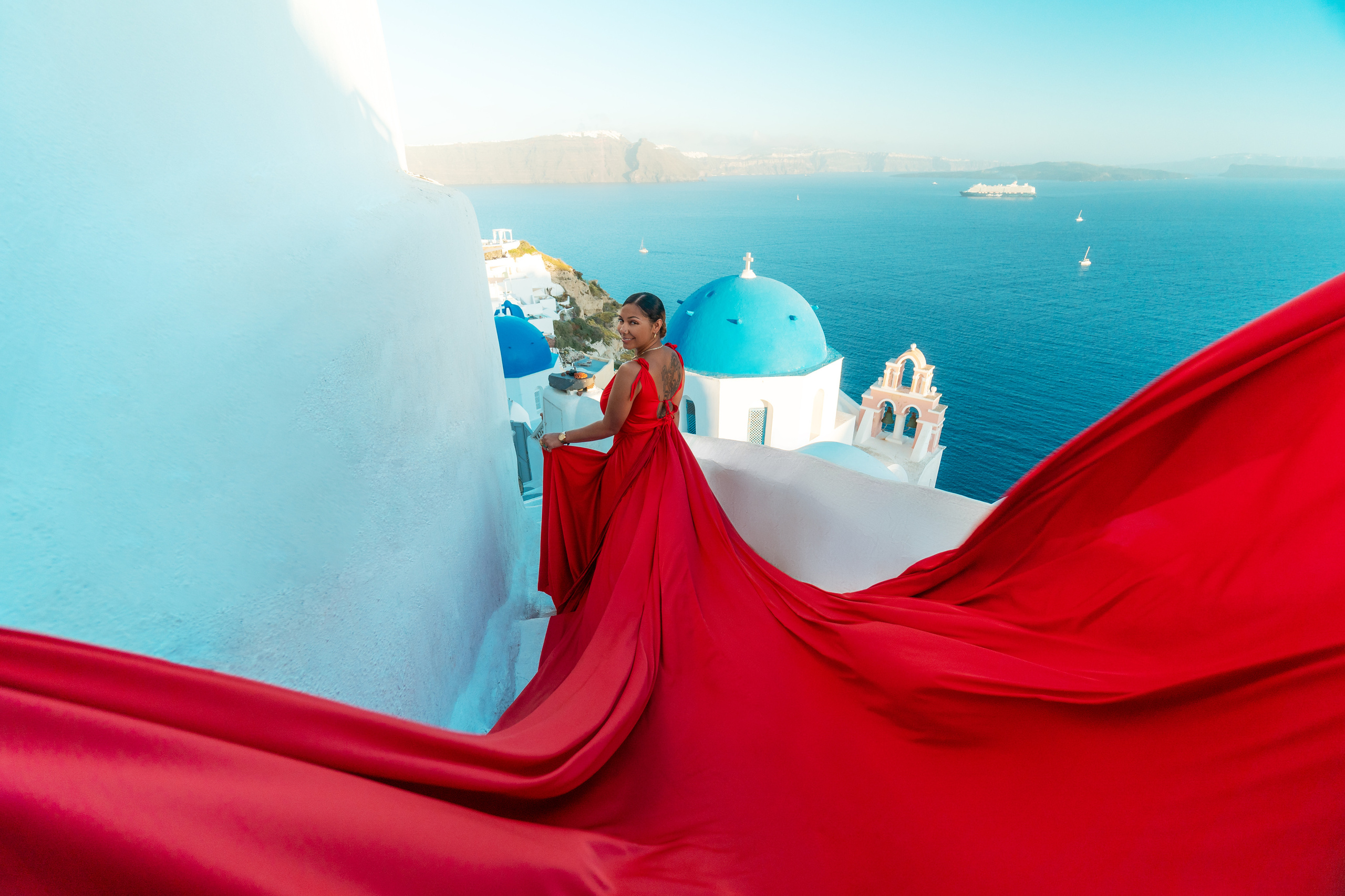 Group photoshoot in flying dress in Oia. Photographer in Santorini SokoLOVE Alex| Flying Dress Santorini