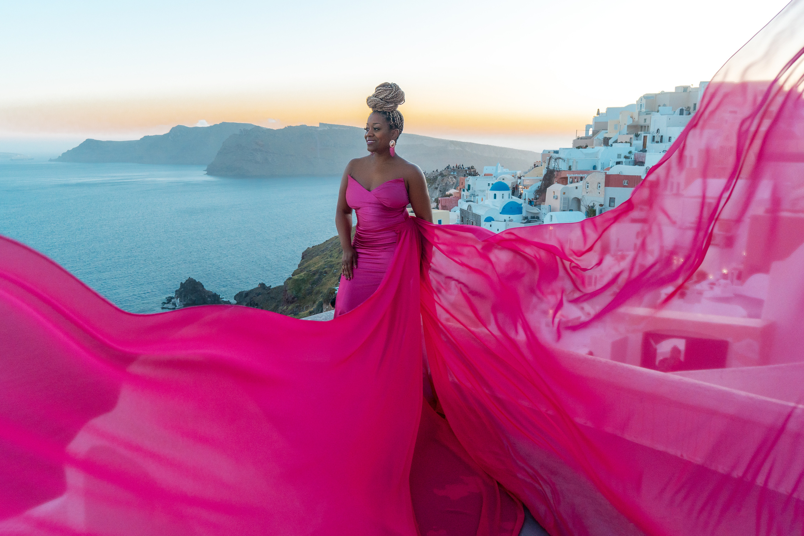 Group photoshoot in flying dress in Oia. Photographer in Santorini SokoLOVE Alex| Flying Dress Santorini