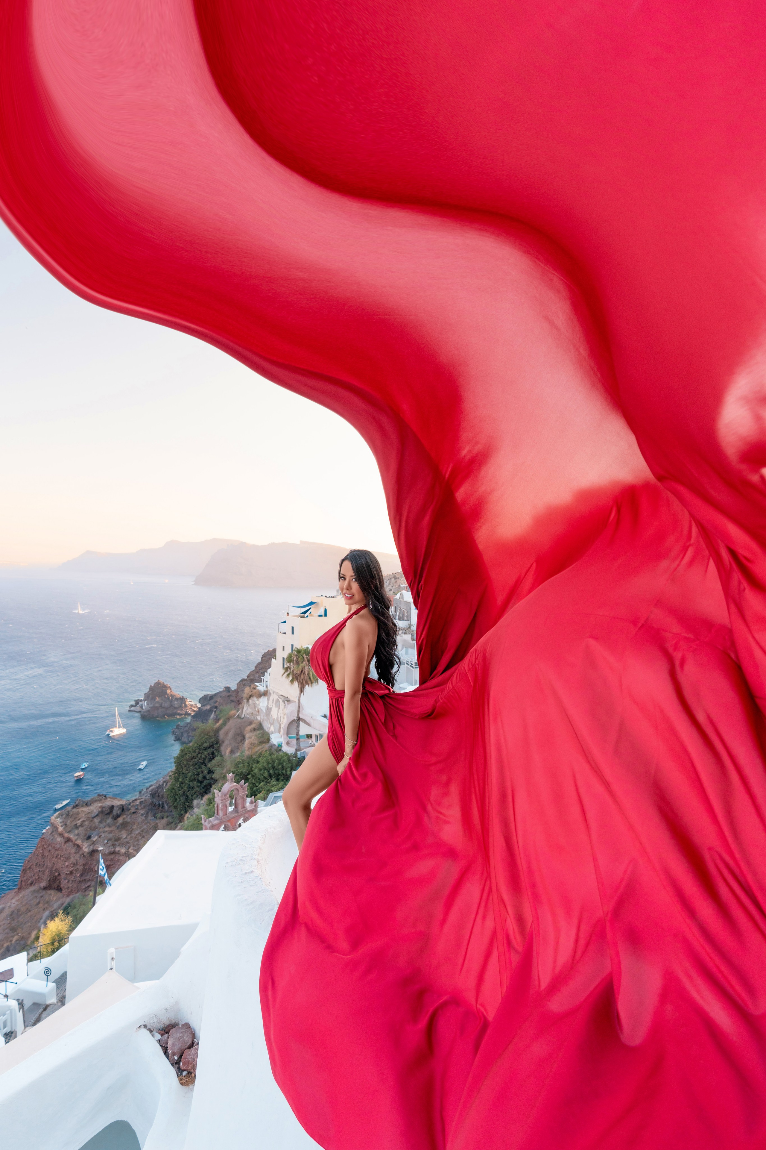 Nathalie Sossa in a flying dress Santorini photoshooting by SokoLOVE