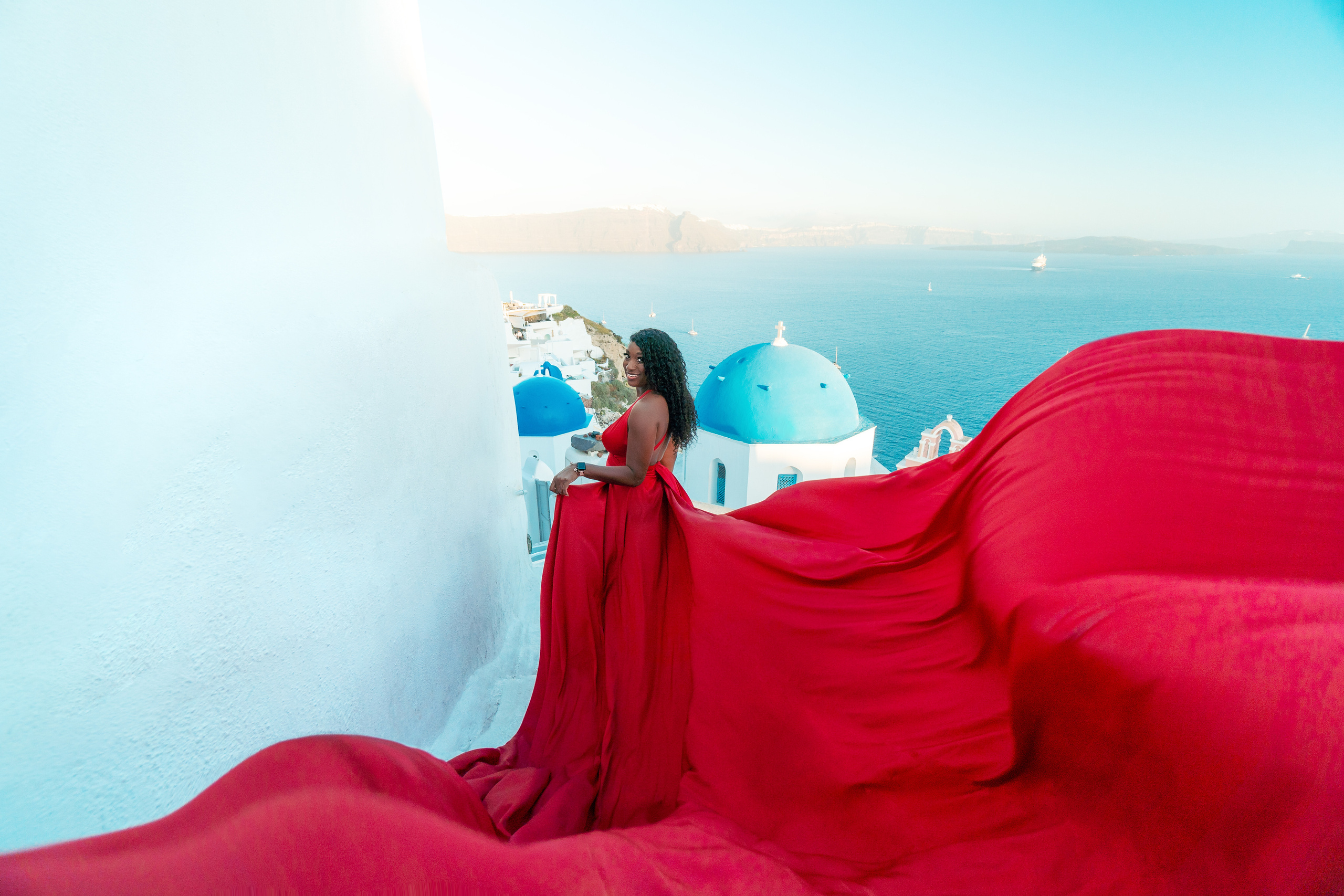 Group photoshoot in flying dress in Oia. Photographer in Santorini SokoLOVE Alex| Flying Dress Santorini
