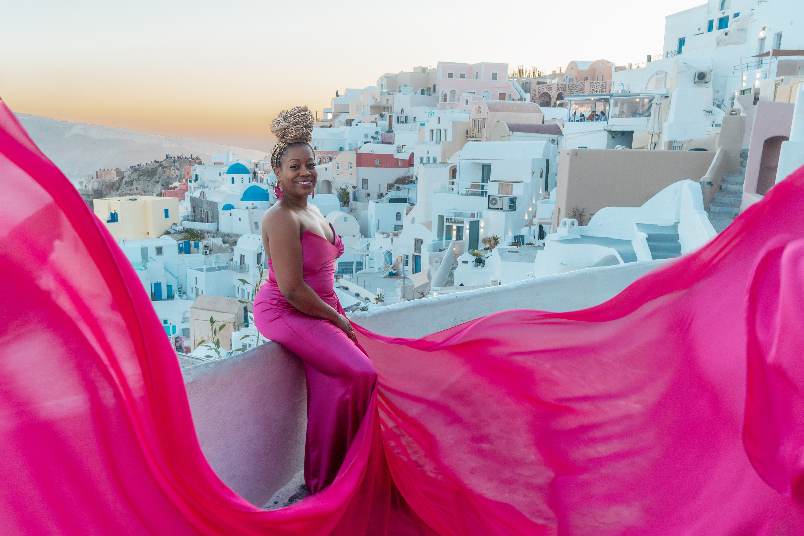 Group photoshoot in flying dress in Oia. Photographer in Santorini SokoLOVE Alex| Flying Dress Santorini