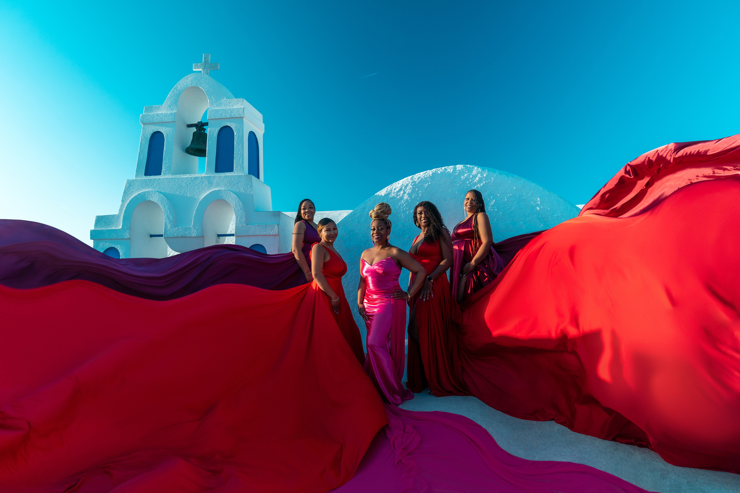 Group photoshoot in flying dress in Oia. Photographer in Santorini SokoLOVE Alex| Flying Dress Santorini