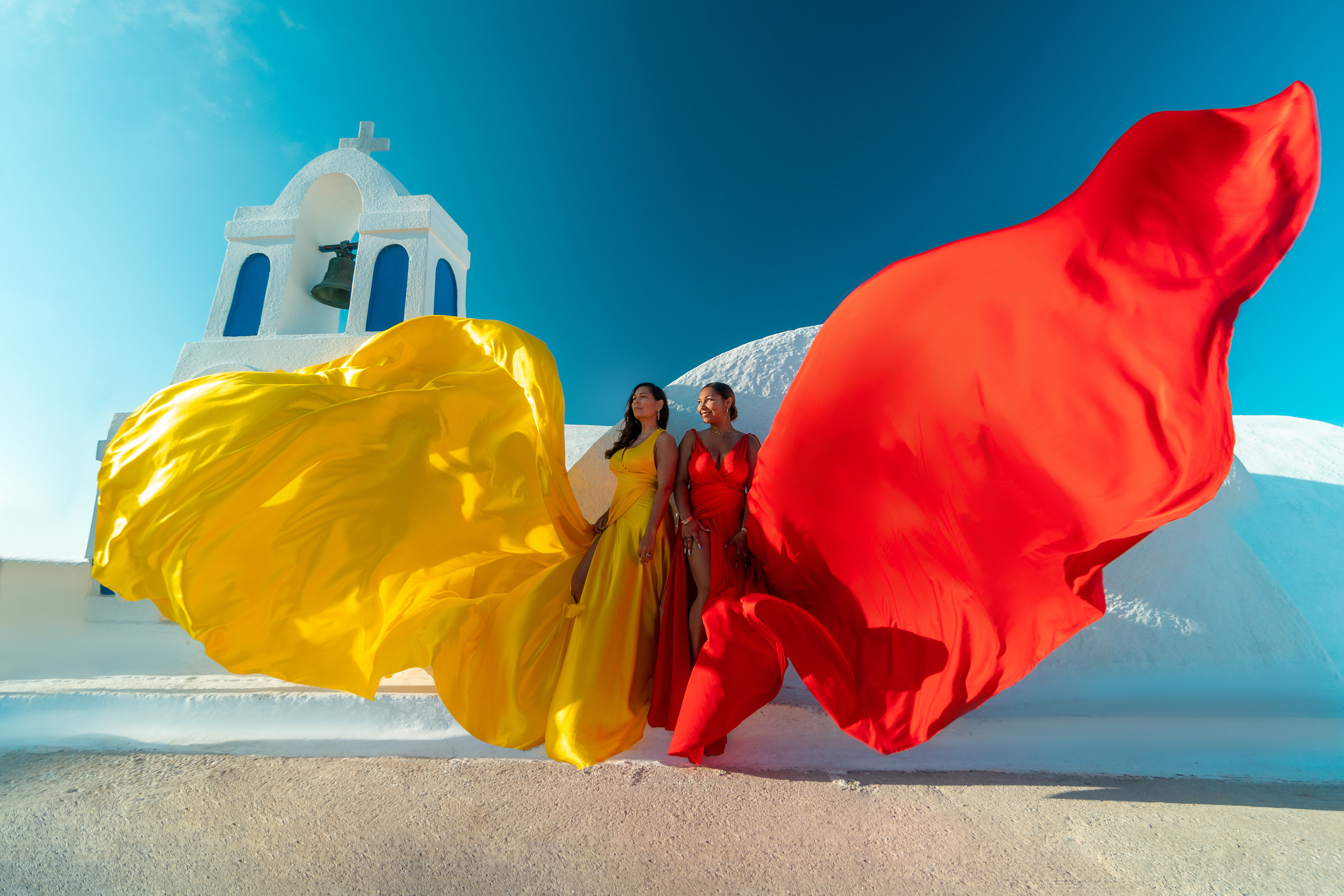 Group photoshoot in flying dress in Oia. Photographer in Santorini SokoLOVE Alex| Flying Dress Santorini