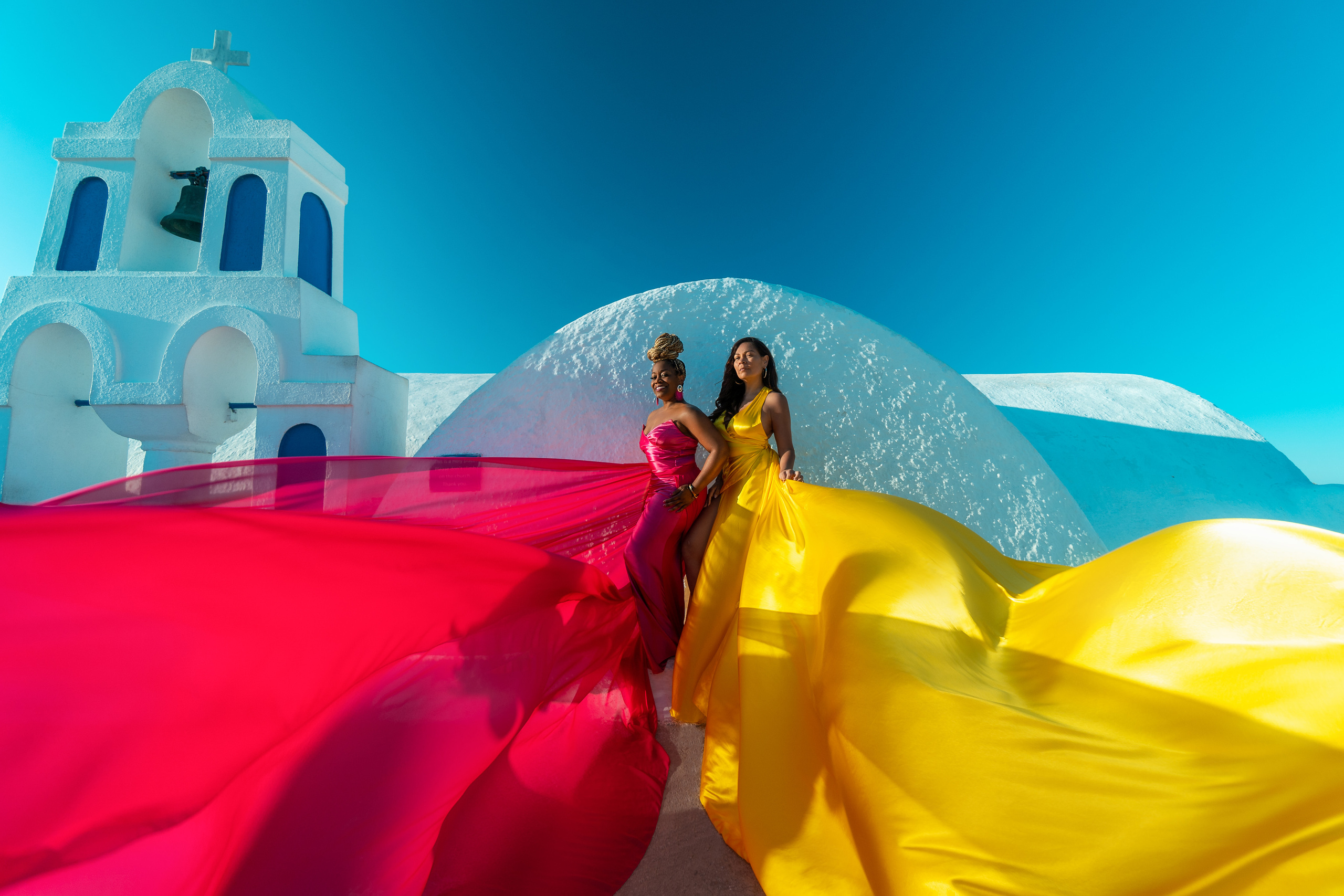 Group photoshoot in flying dress in Oia. Photographer in Santorini SokoLOVE Alex| Flying Dress Santorini