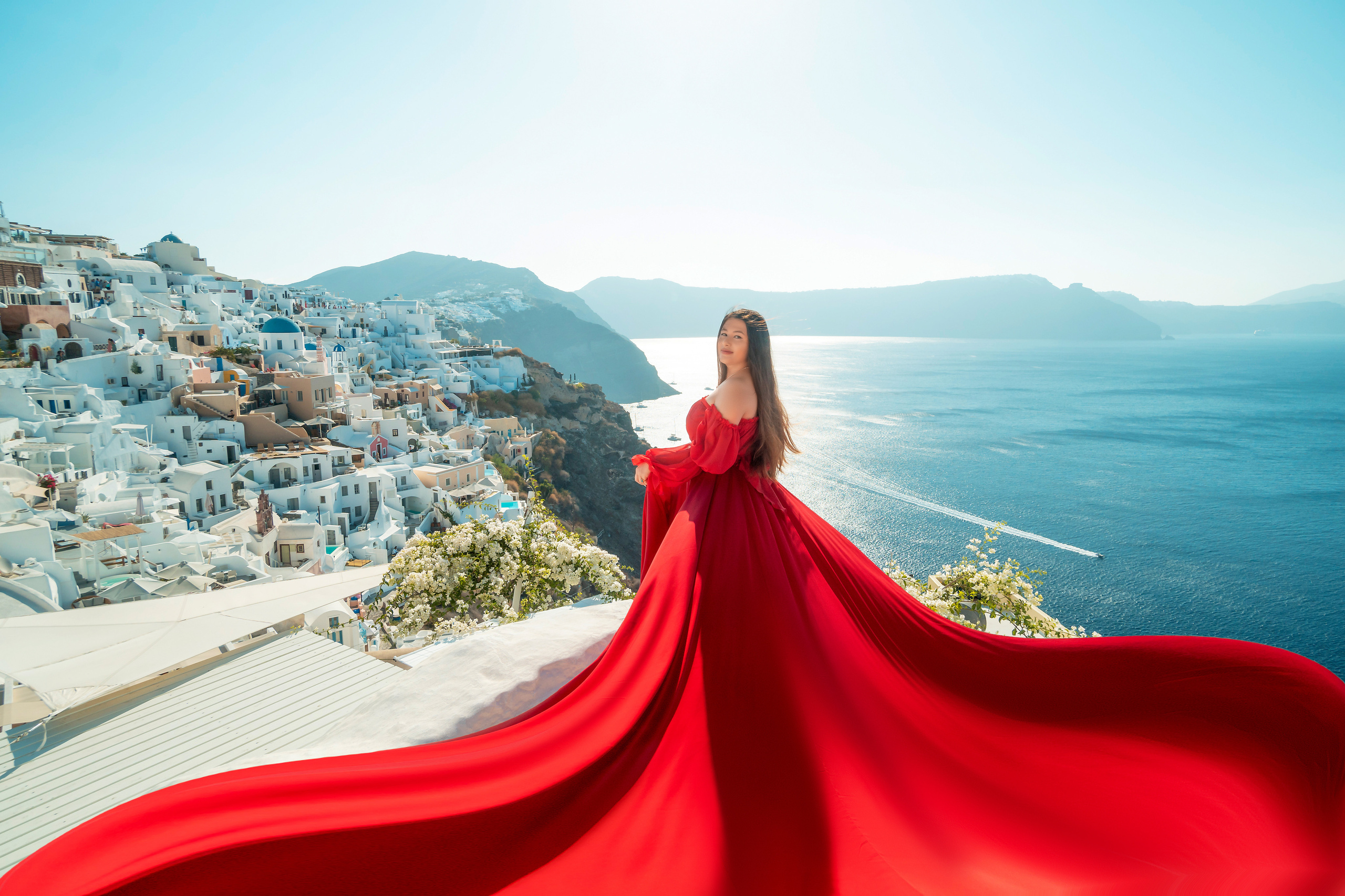 "Create magical family memories with a Flying Dress photoshoot in Santorini by Sokolove. Capture stunning moments of elegance and beauty against the island’s breathtaking landscapes, creating timeless portraits for the whole family."