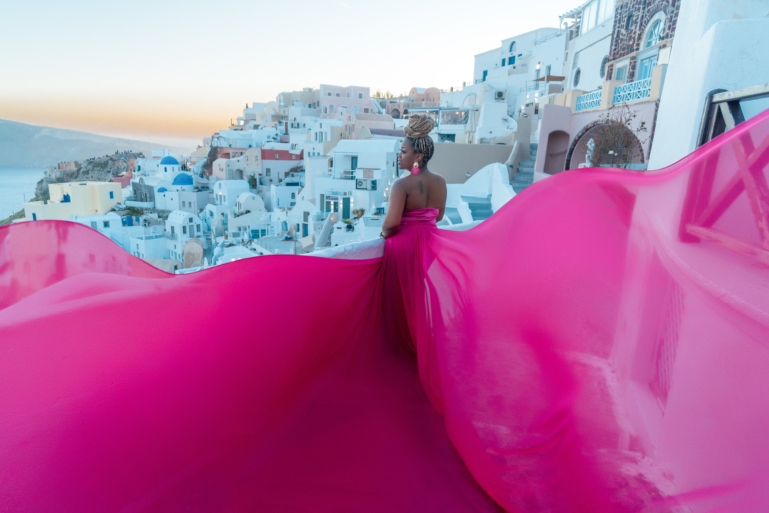 Group photoshoot in flying dress in Oia. Photographer in Santorini SokoLOVE Alex| Flying Dress Santorini
