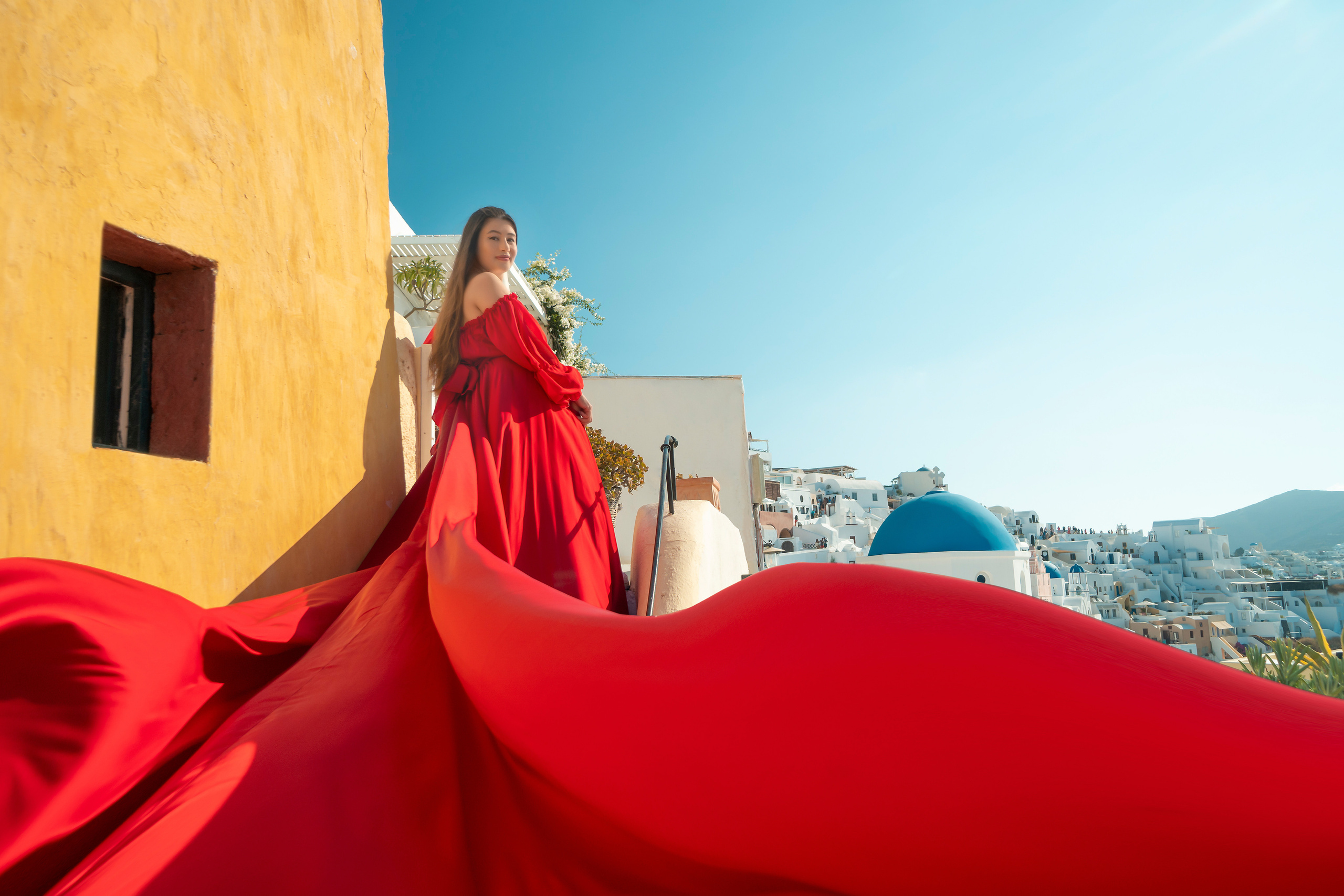 "Book your family’s Flying Dress photoshoot in Santorini with Sokolove. Our expert photographer captures the joy and elegance of your family against the stunning backdrop of Santorini’s iconic landscapes and sunsets."