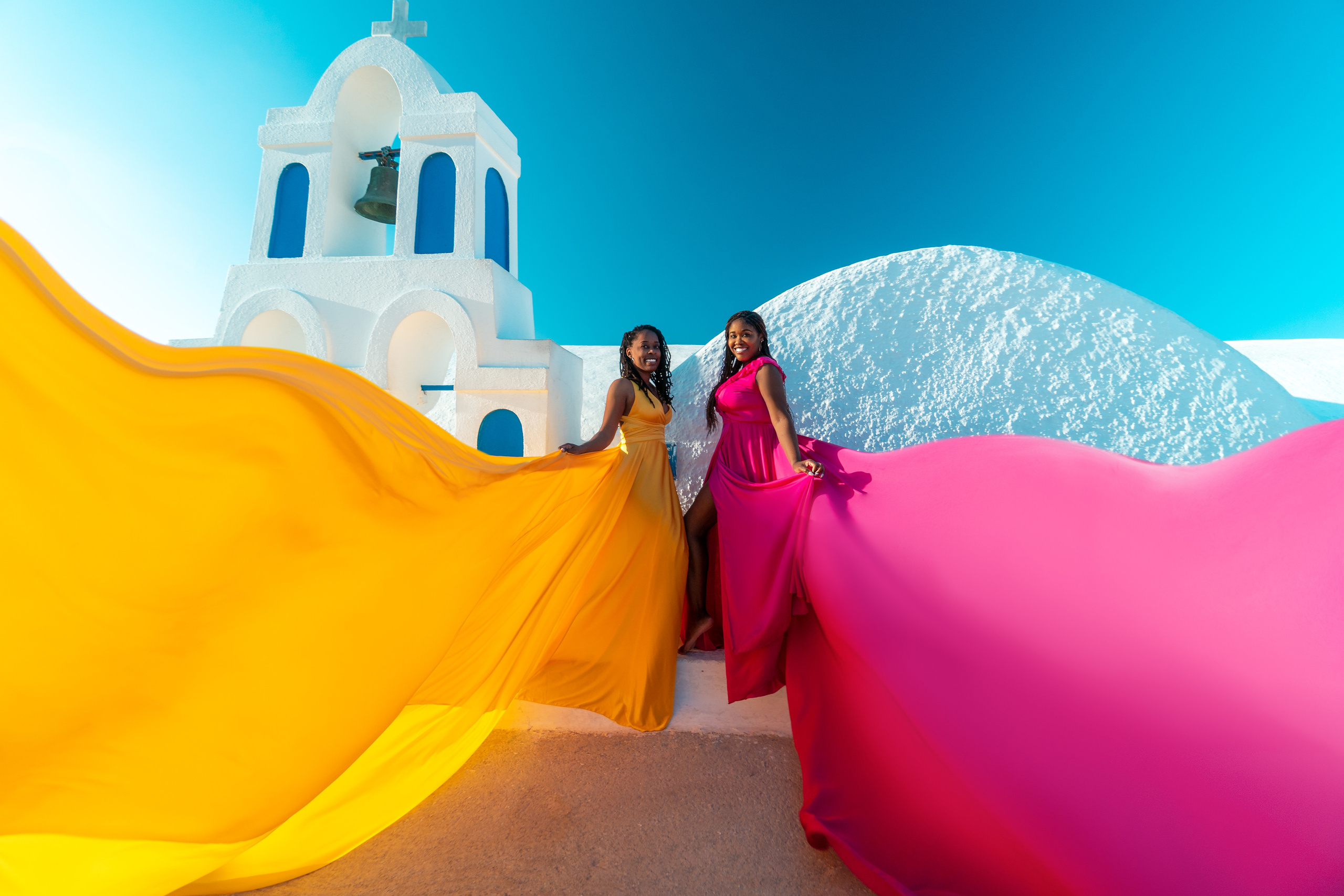 Group photoshoot in flying dress in Oia. Photographer in Santorini SokoLOVE Alex| Flying Dress Santorini