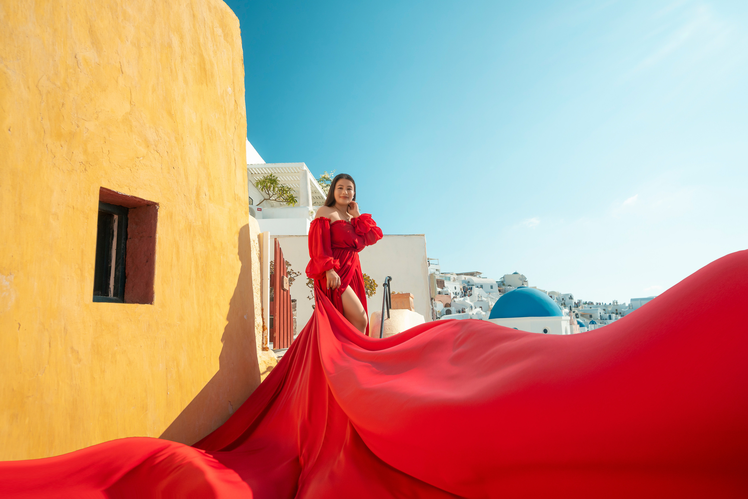 "Celebrate your family’s love with a Flying Dress photoshoot in Santorini, designed by Sokolove. With breathtaking views and elegant flying dresses, your family portraits will be a true work of art, showcasing beauty and grace."