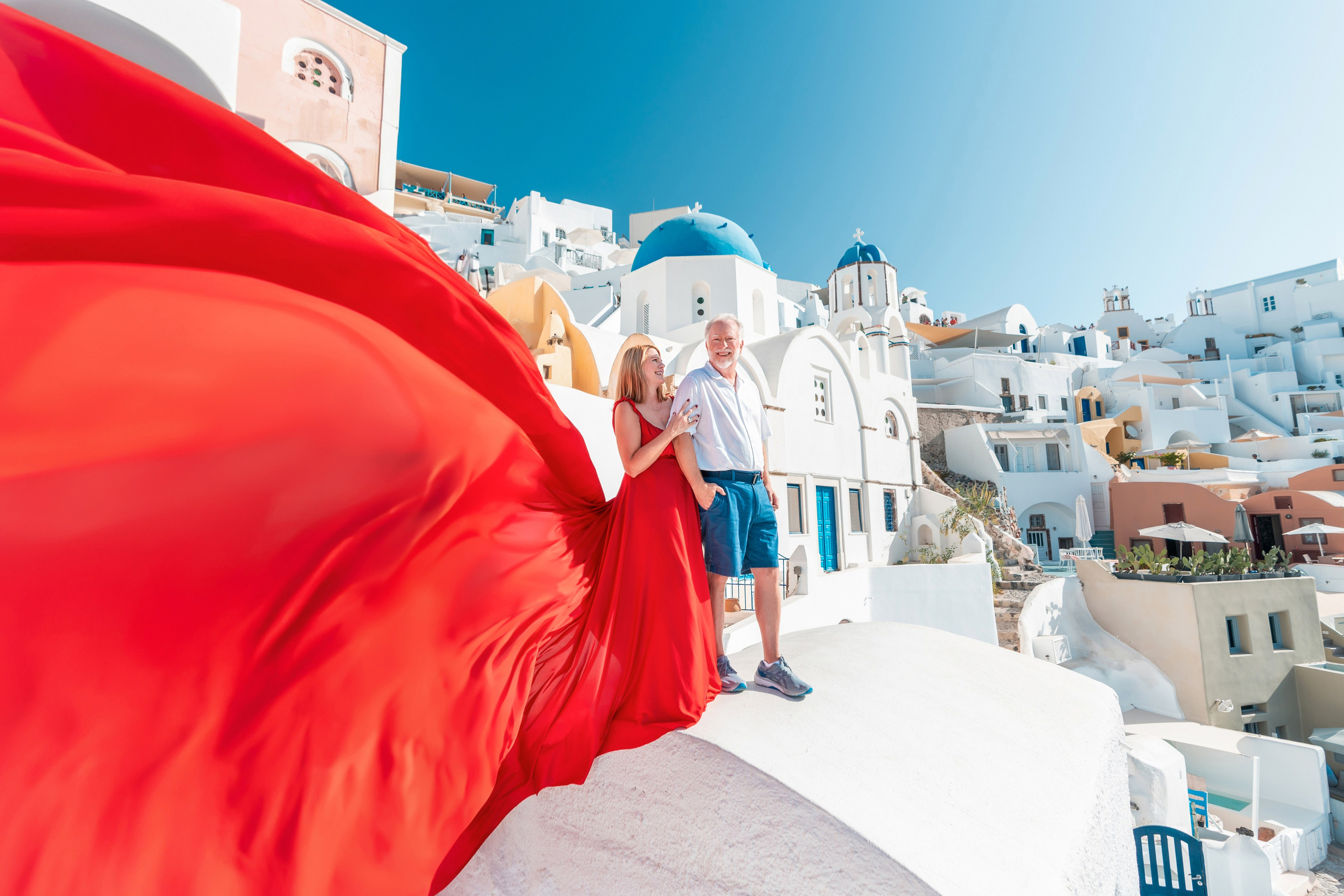 Why a Photoshoot Is the Perfect Way to Celebrate Life’s Biggest Moments in Santorini. Photographer in Santorini SokoLOVE Alex| Flying Dress Santorini