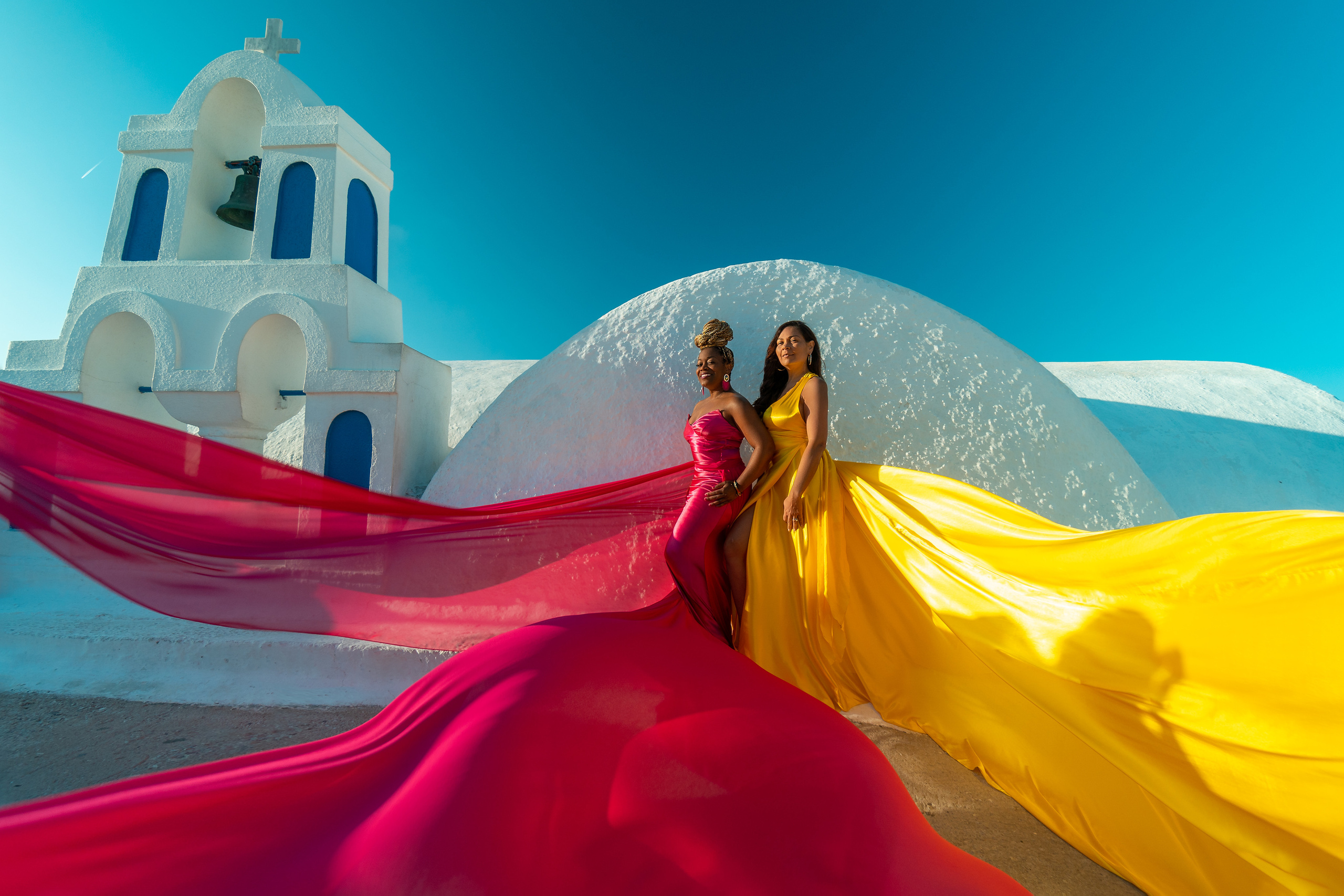 Group photoshoot in flying dress in Oia. Photographer in Santorini SokoLOVE Alex| Flying Dress Santorini