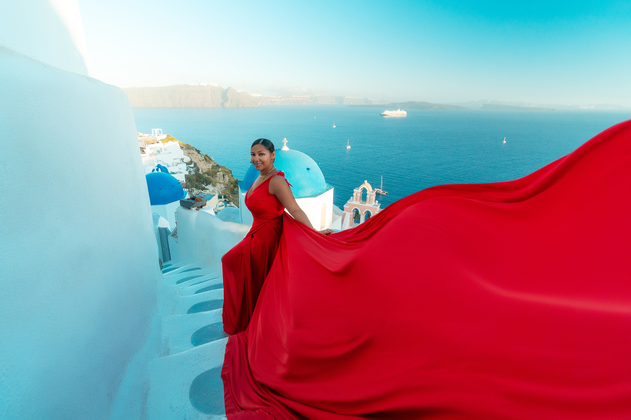 Group photoshoot in flying dress in Oia. Photographer in Santorini SokoLOVE Alex| Flying Dress Santorini
