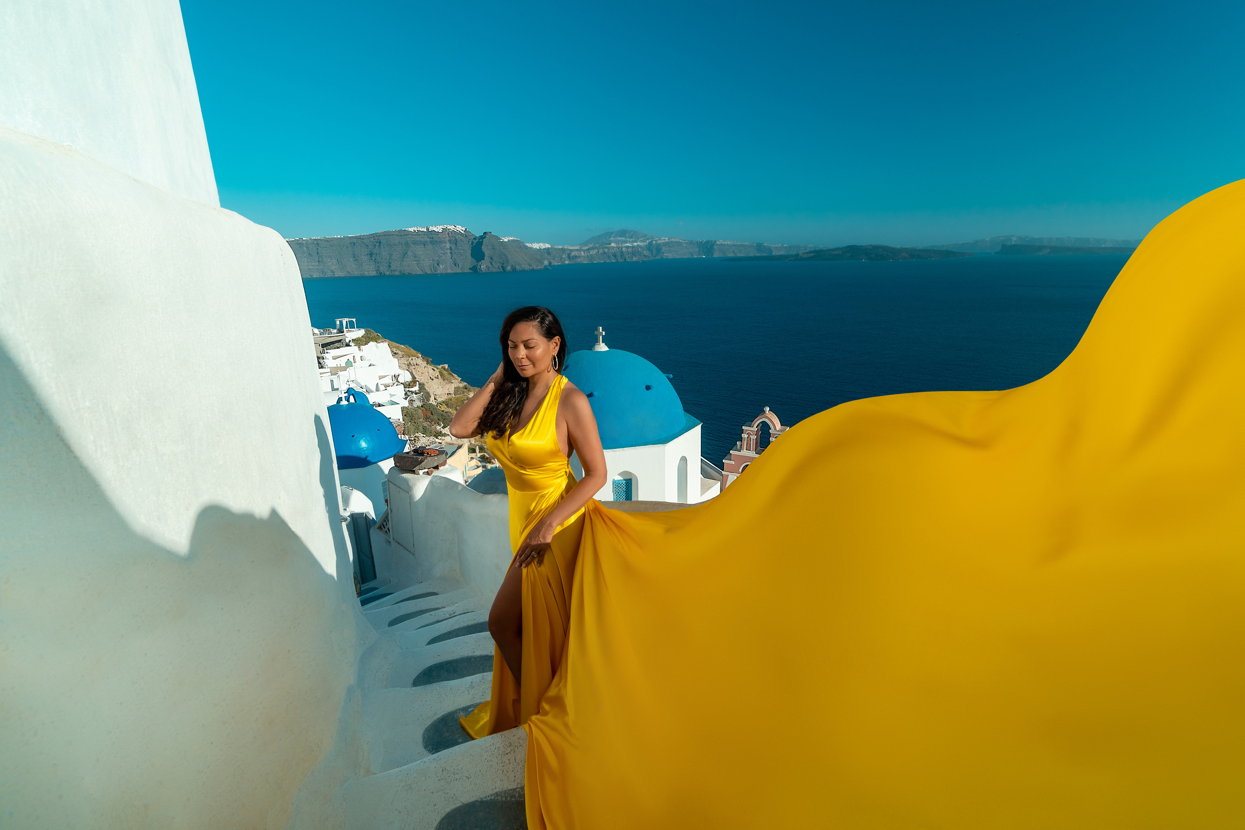 Group photoshoot in flying dress in Oia. Photographer in Santorini SokoLOVE Alex| Flying Dress Santorini