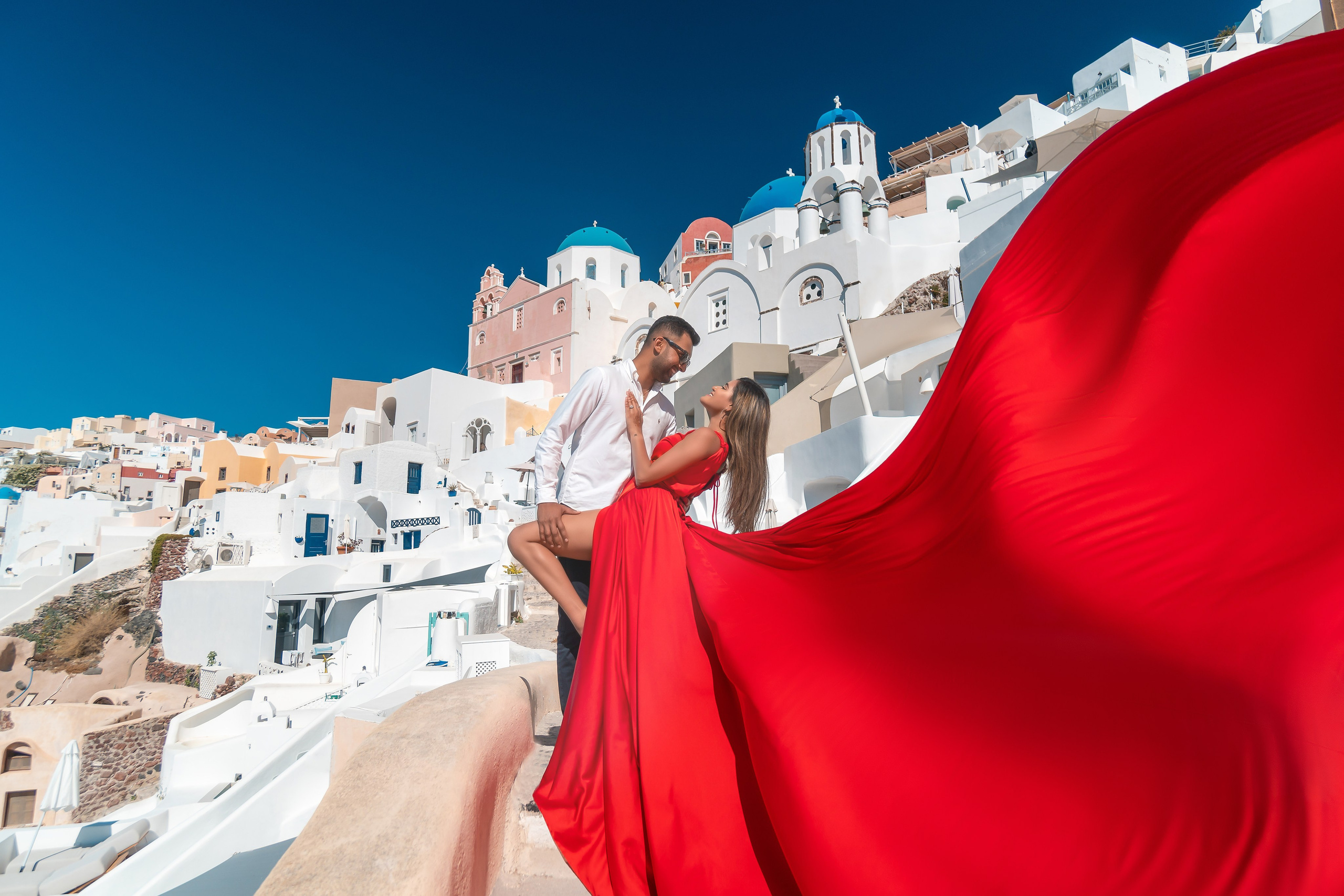 Private Photoshoot in Oia, Santorini | Blue Domes & Caldera Santorini. Flying Dress Santorini Photographer | SokoLOVE — Book 2026