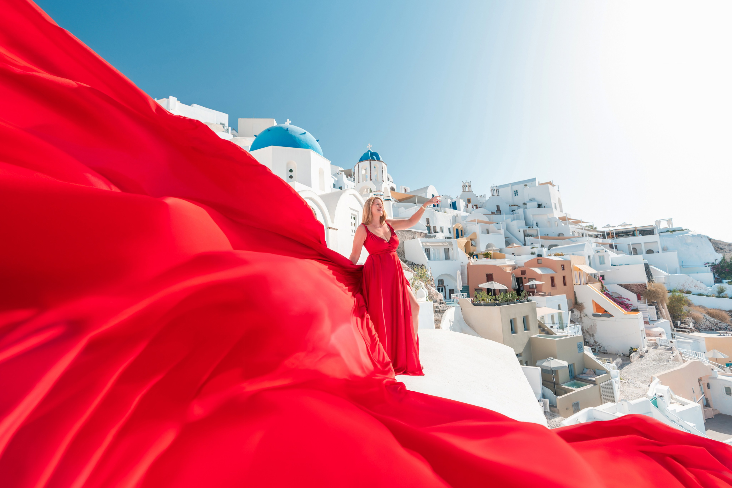 Why a Photoshoot Is the Perfect Way to Celebrate Life’s Biggest Moments in Santorini. Photographer in Santorini SokoLOVE Alex| Flying Dress Santorini