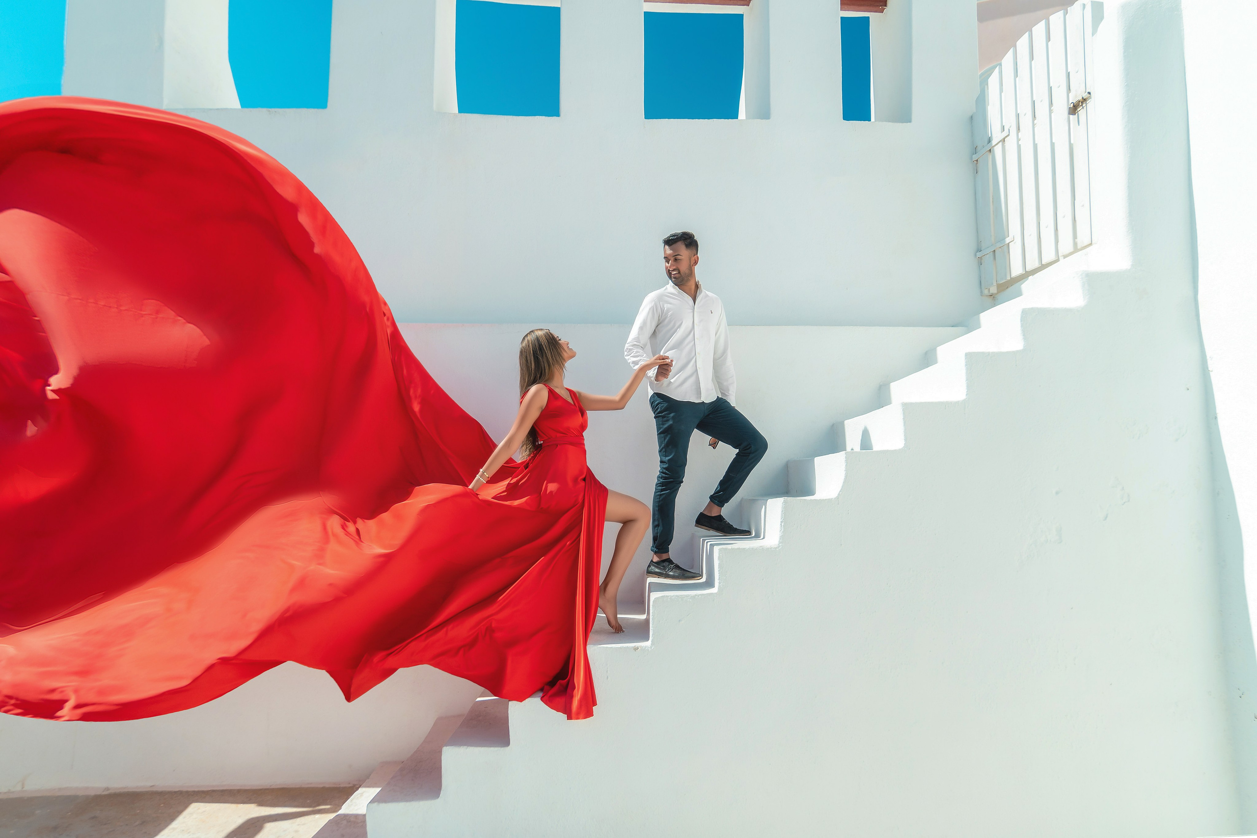 Santorini’s Magic in Motion: Flying Dress Photoshoot with a Lovely Couple from India. Photographer in Santorini SokoLOVE Alex| Flying Dress Santorini