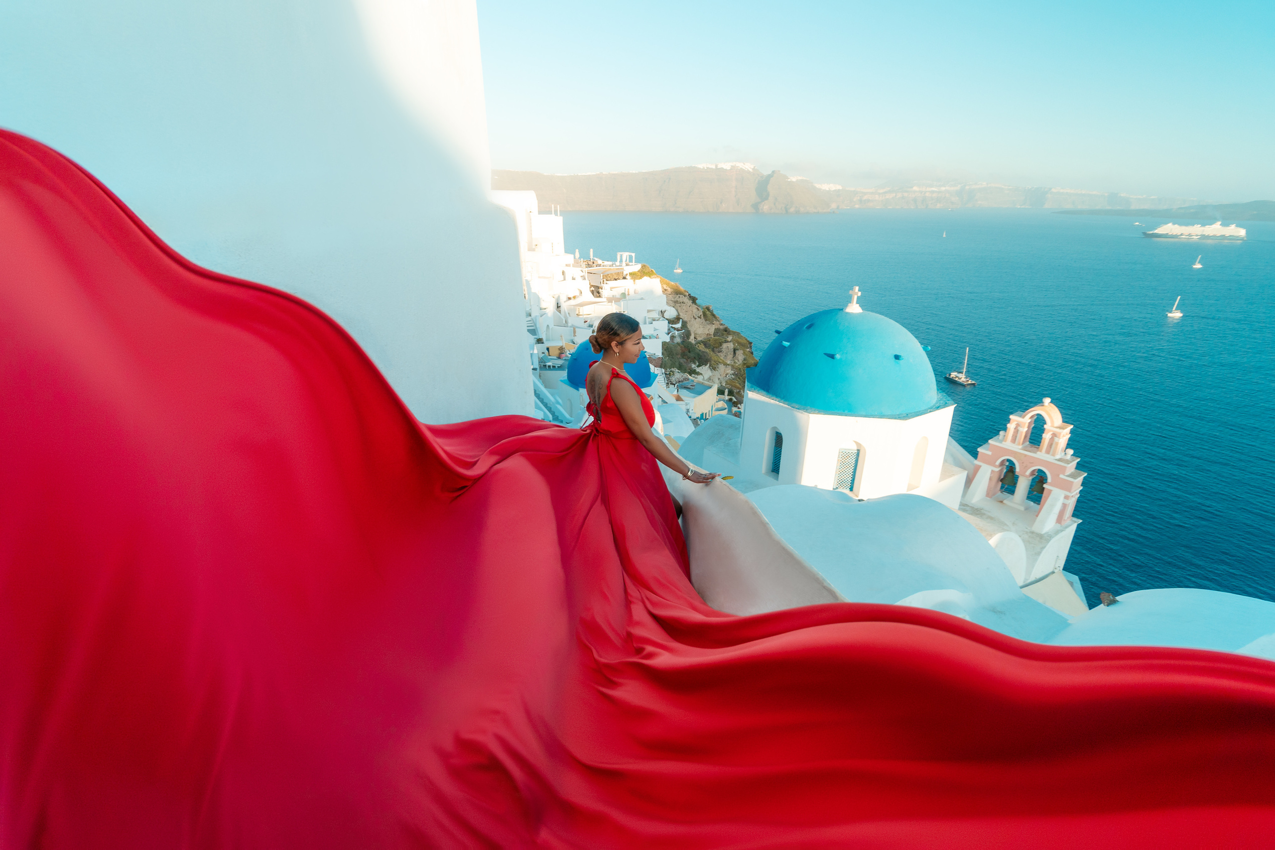 Group photoshoot in flying dress in Oia. Photographer in Santorini SokoLOVE Alex| Flying Dress Santorini