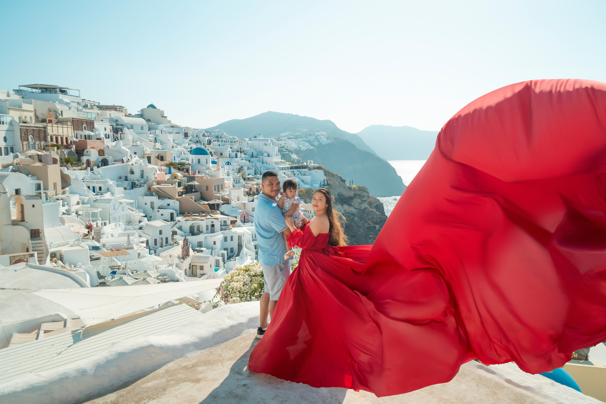 "Book your family’s Flying Dress photoshoot in Santorini with Sokolove. Our expert photographer captures the joy and elegance of your family against the stunning backdrop of Santorini’s iconic landscapes and sunsets."