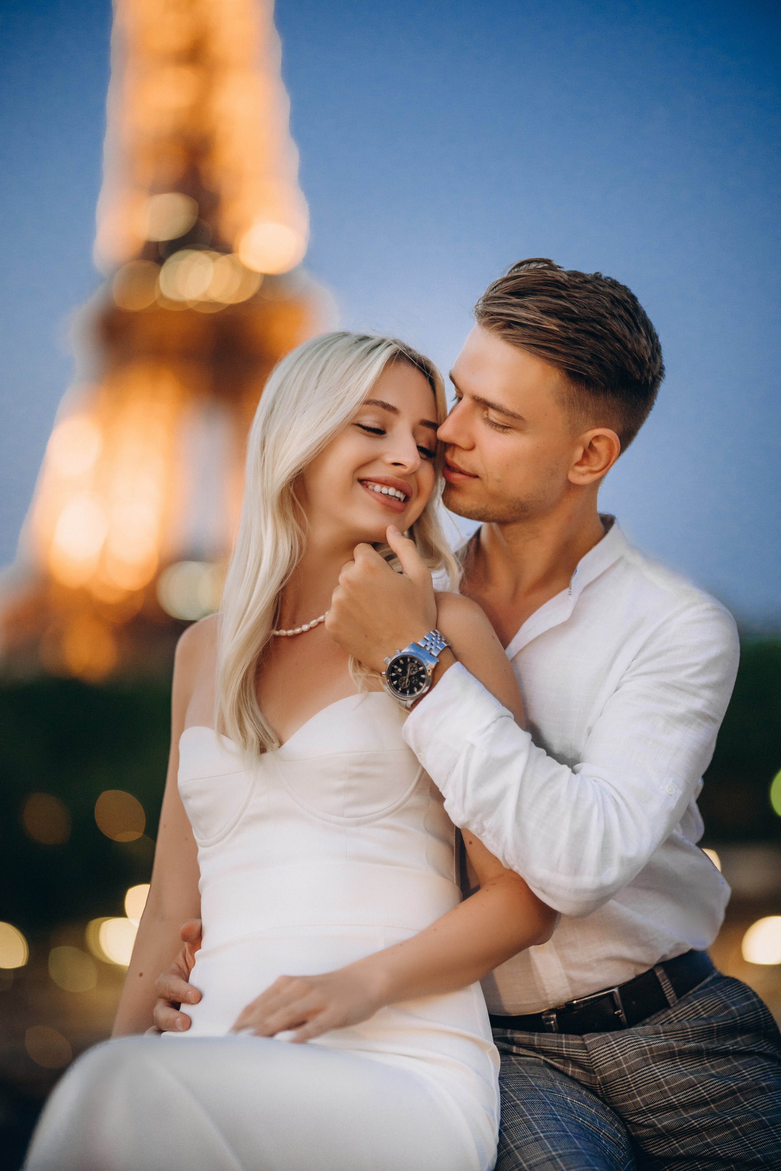 Night photo shoot near the illuminated Eiffel Tower