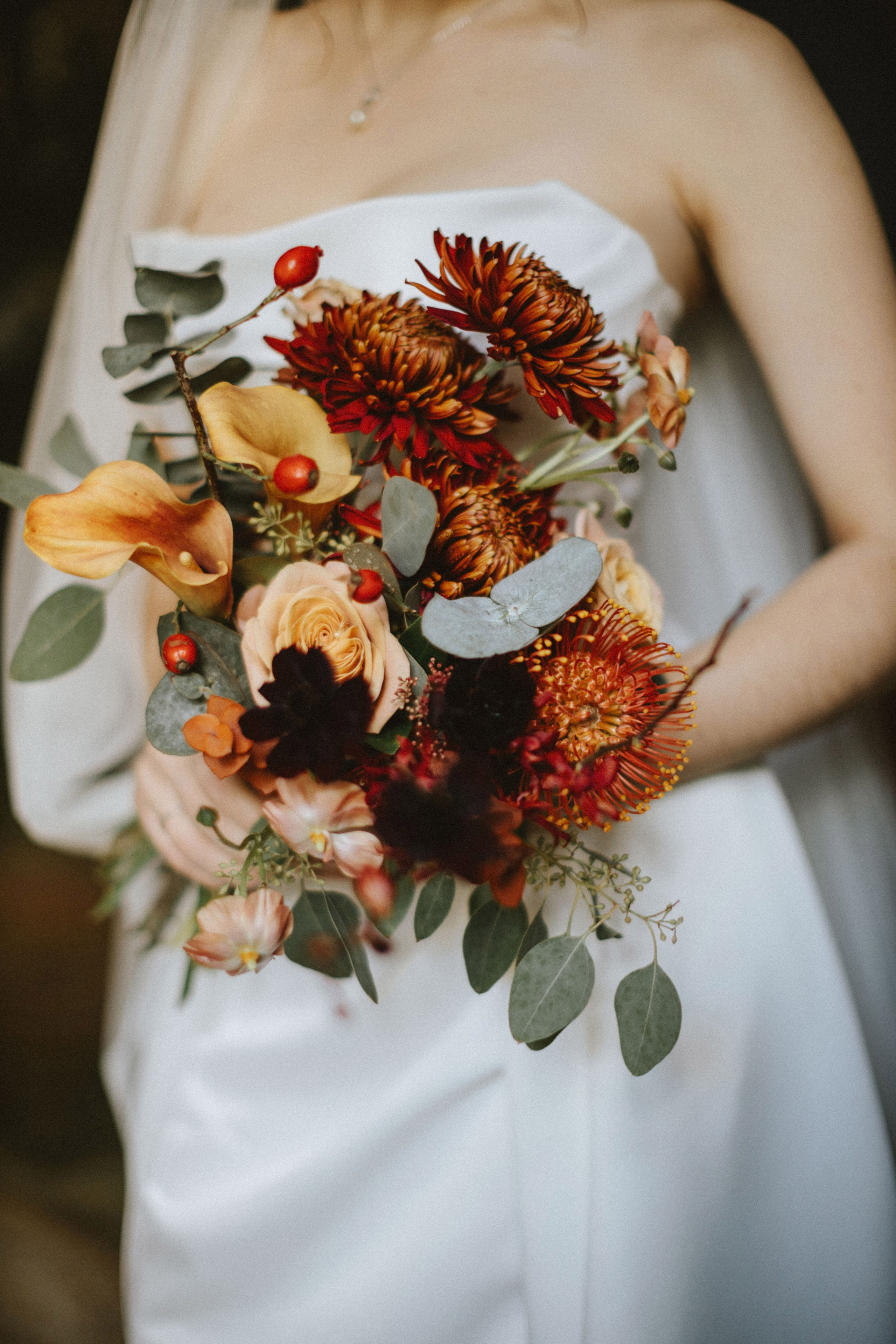 "Wedding details rings and bouquet"