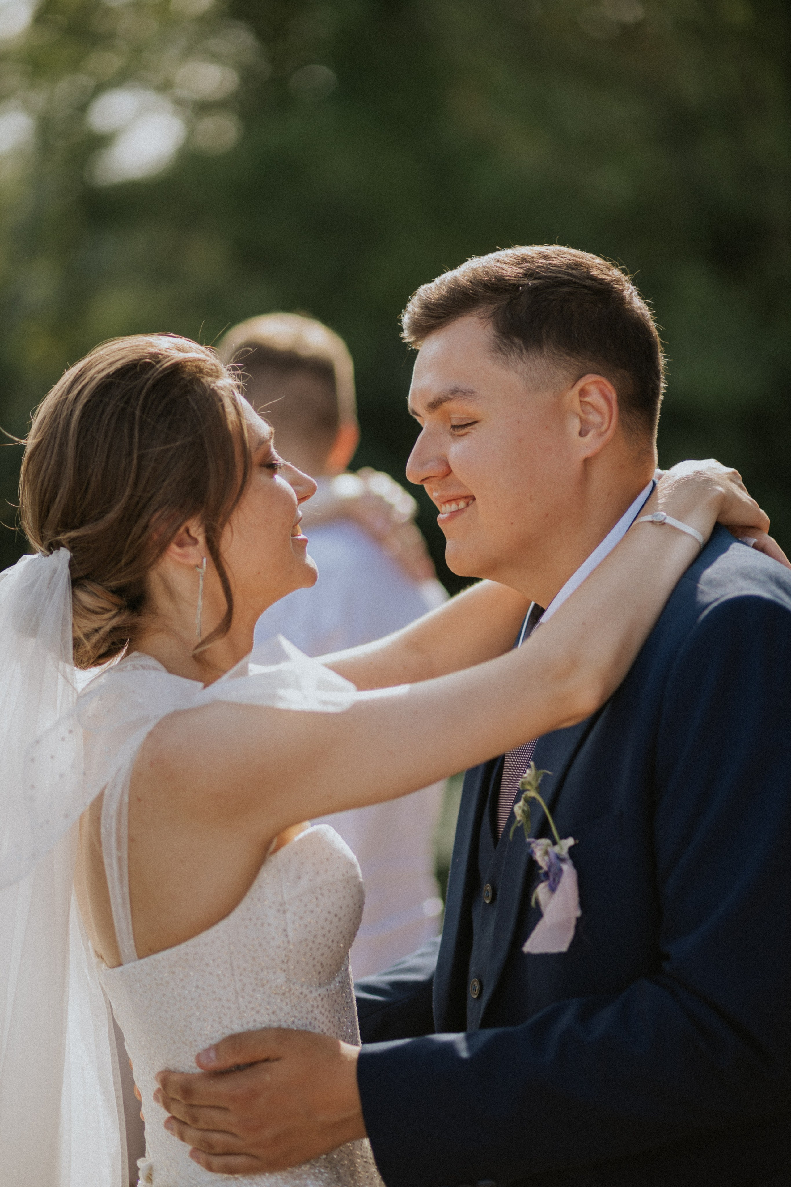 "Bride and groom smiling during reception"