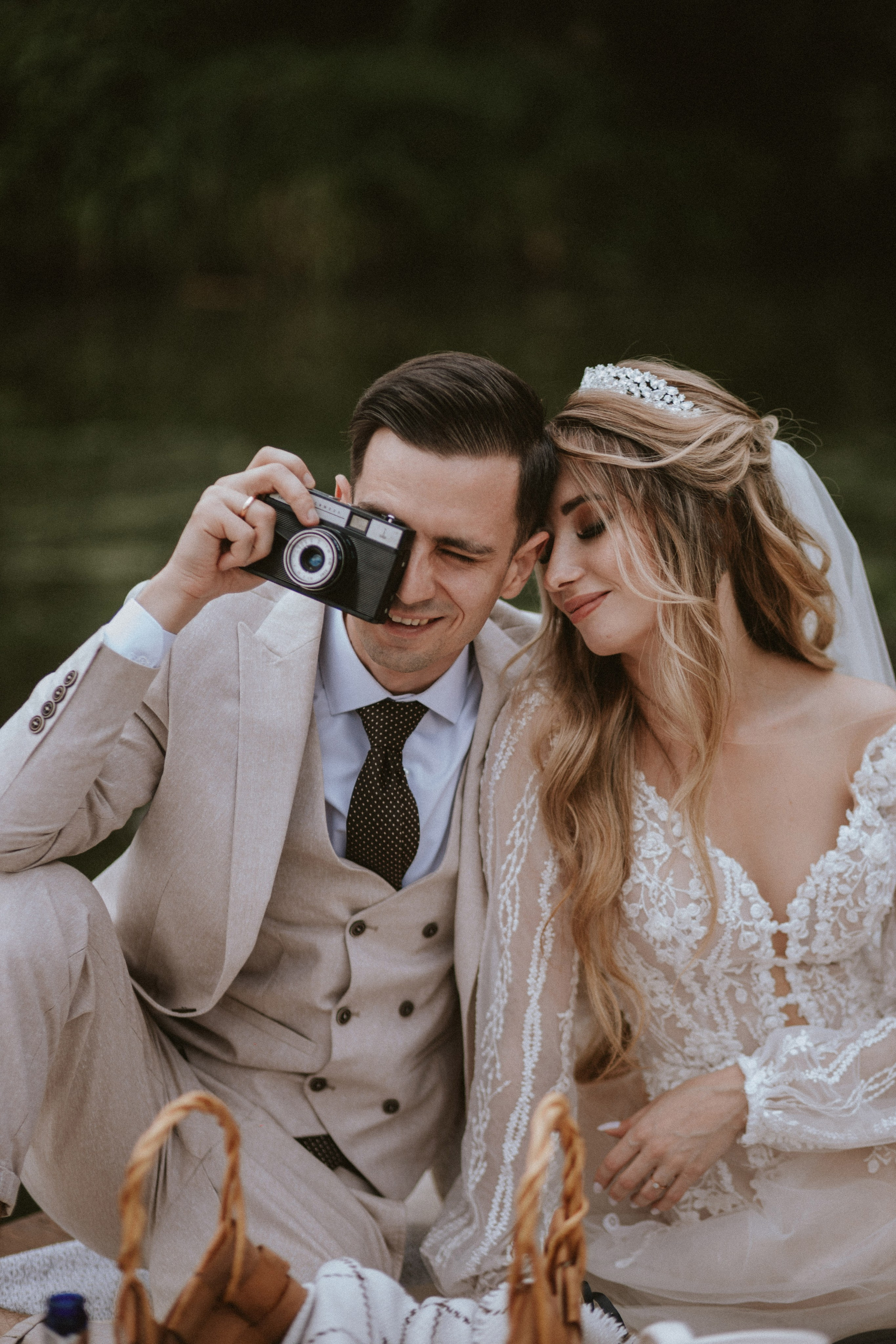 Wedding couple laughing and enjoying intimate outdoor celebration