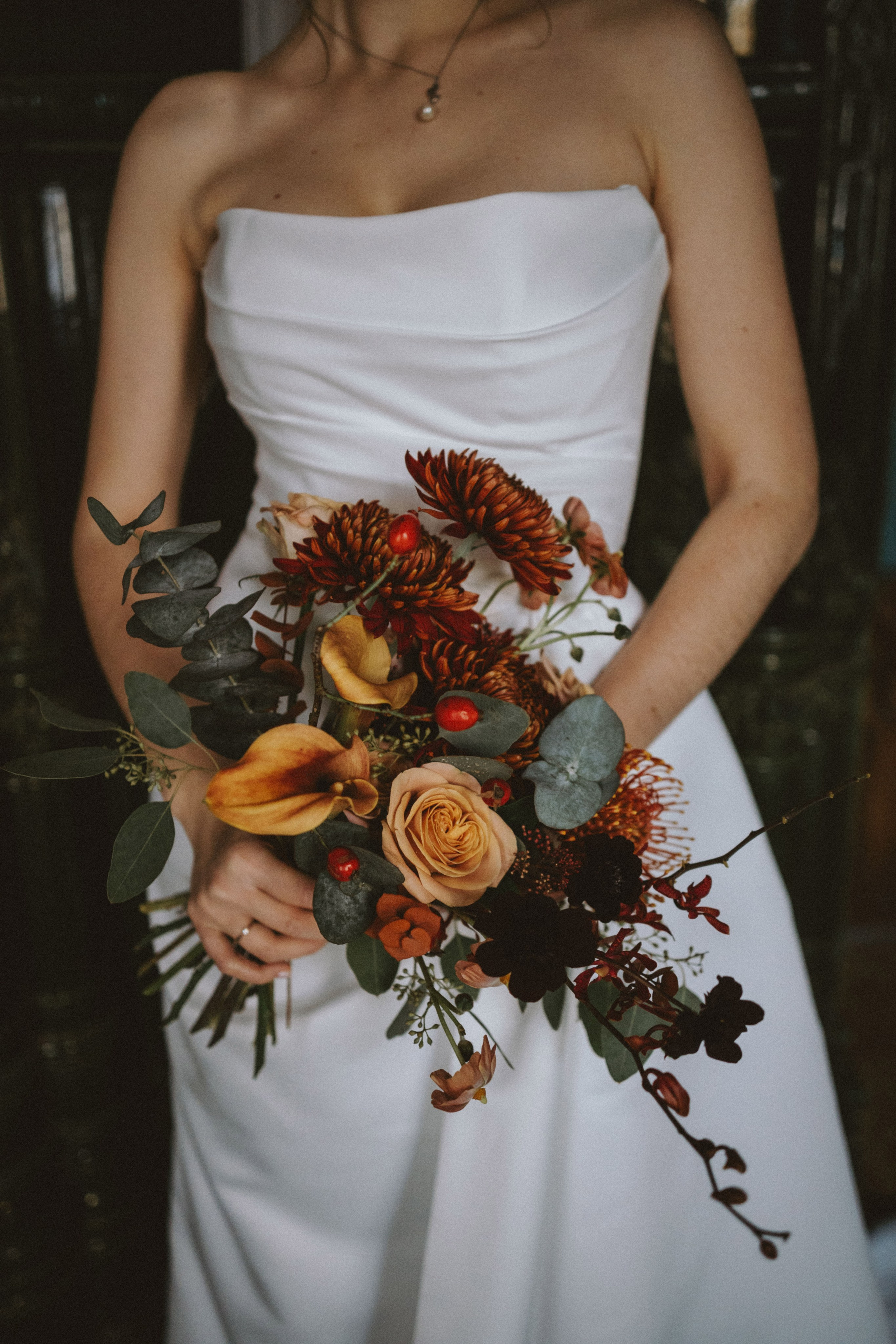 "Wedding details rings and bouquet"