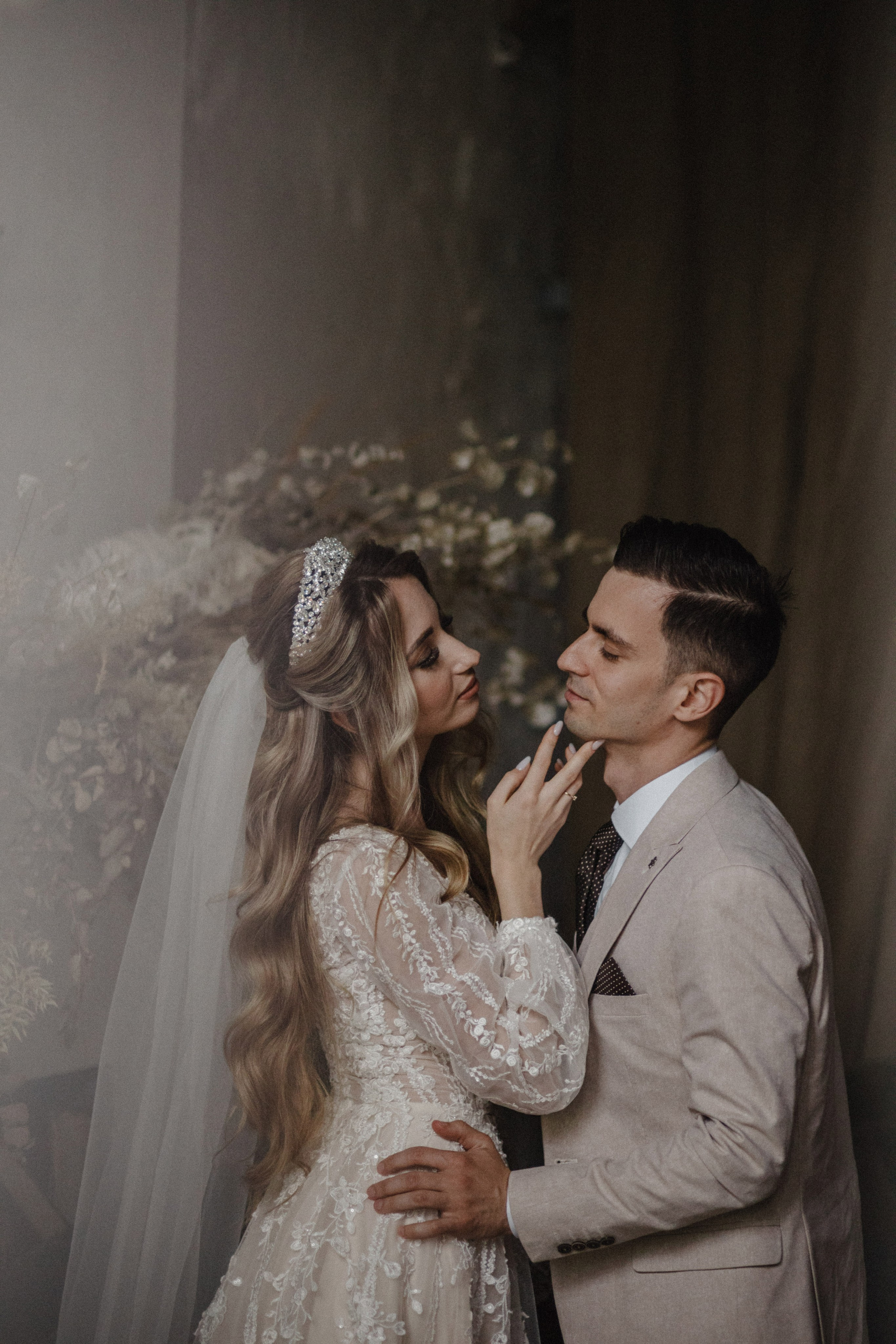 Romantic couple portrait in vintage studio with warm tones