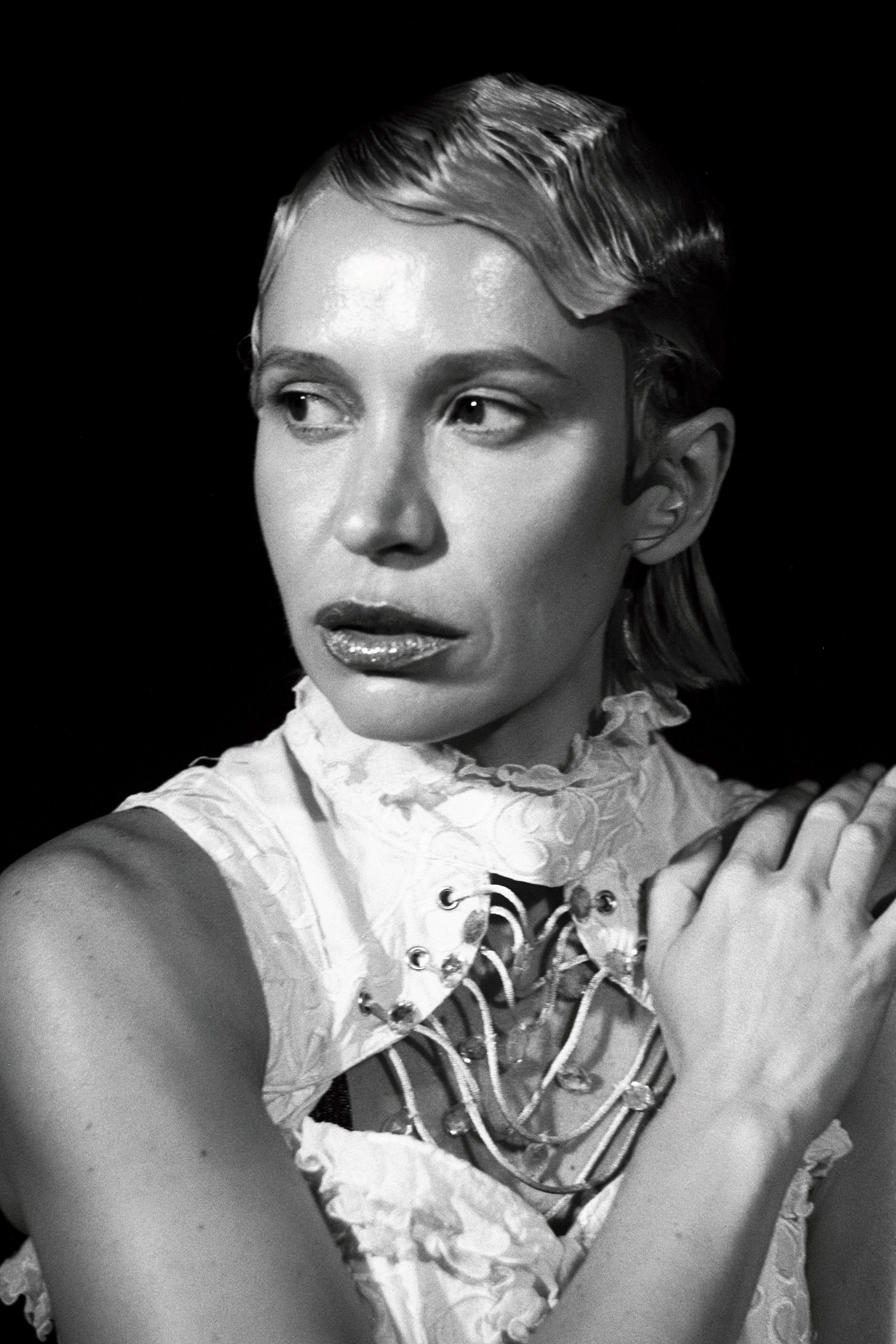 bstract and poetic close-up portrait utilizing shadows, captured on 35mm black and white film by Sasha Khokh