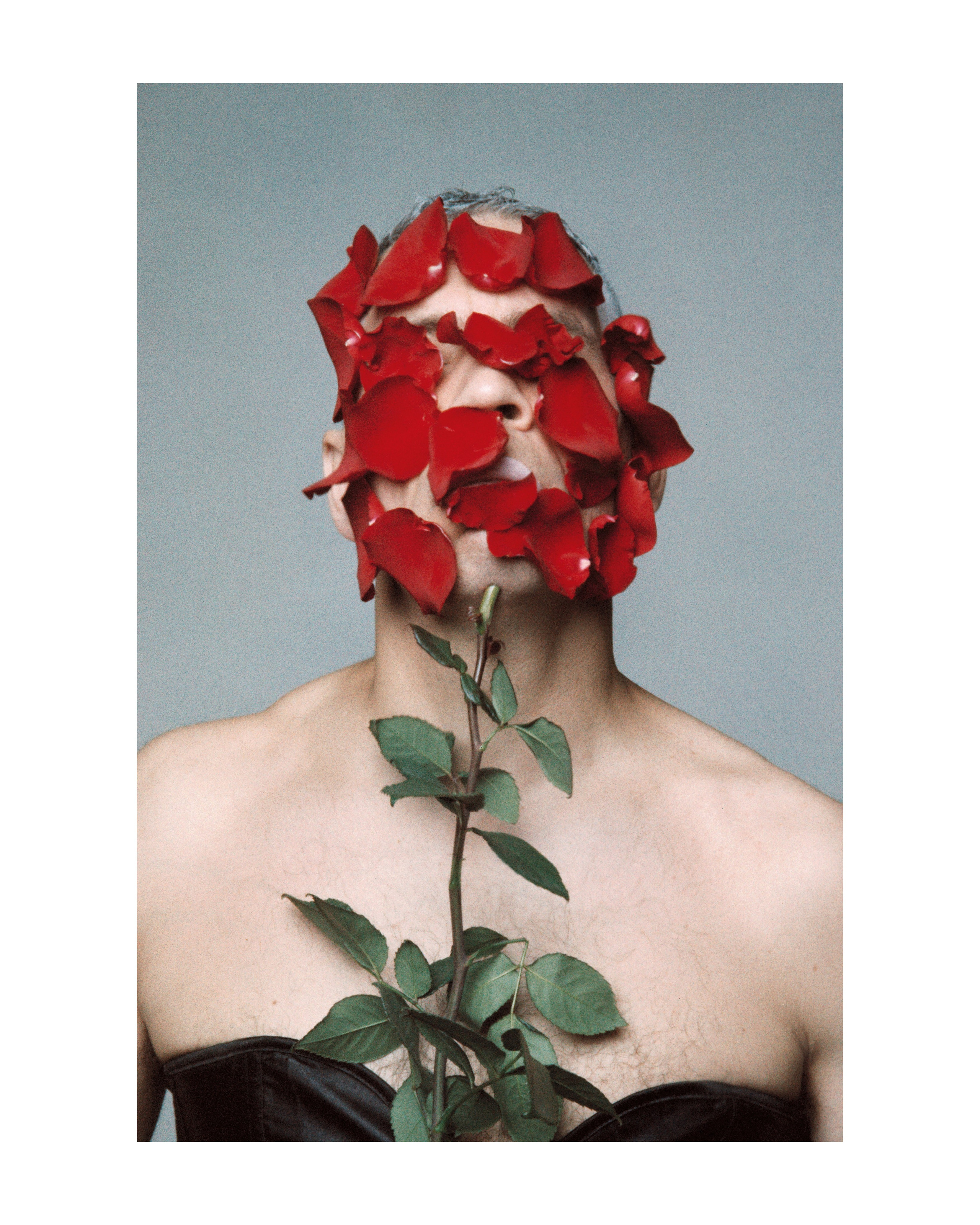 Creative 35mm color film portrait of a man, refined and minimalist studio photography by Sasha Khokh