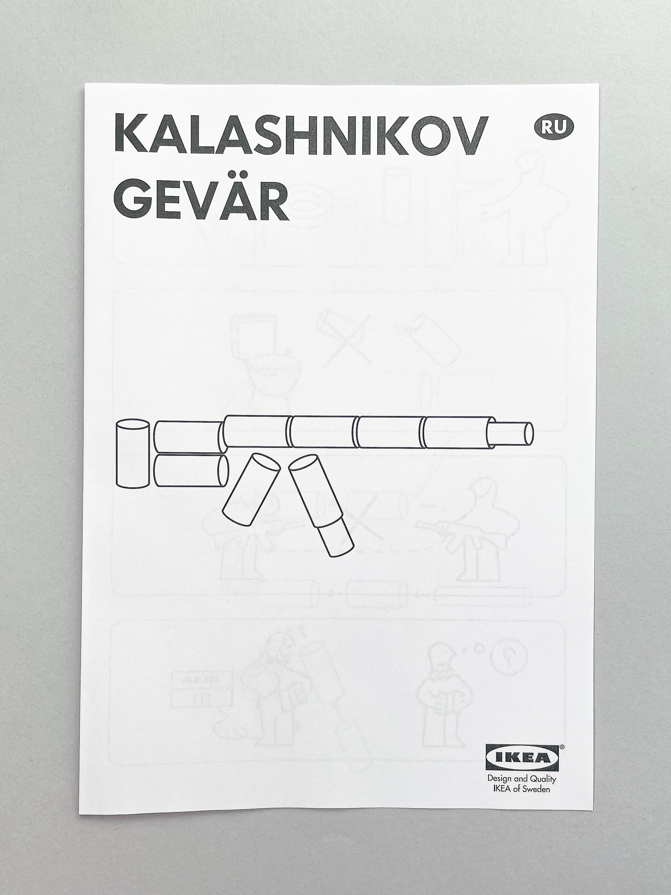 The image shows an instruction sheet designed in the style of IKEA manuals. The title "KALASHNIKOV GEVÄR" is prominently displayed at the top, indicating the product name "Kalashnikov Rifle" in Swedish. Below the title, there is an illustration of a rifle assembled from cardboard toilet paper rolls. The sheet features simple line drawings that suggest how to assemble the rolls into the shape of a rifle. At the bottom right corner, there is an IKEA logo with the text "Design and Quality IKEA of Sweden." The background is a plain, light gray surface.