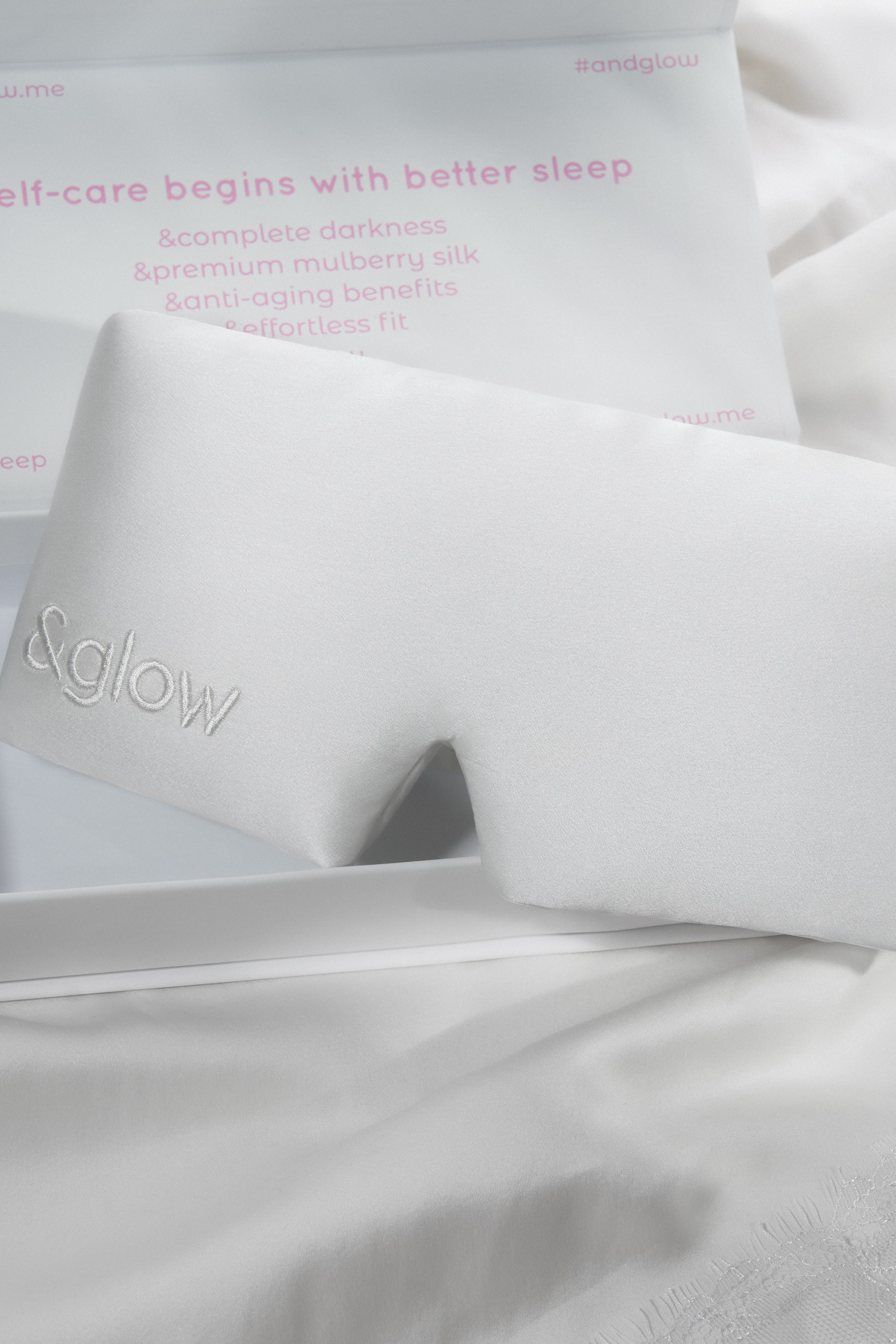 A silk sleep mask: white on white