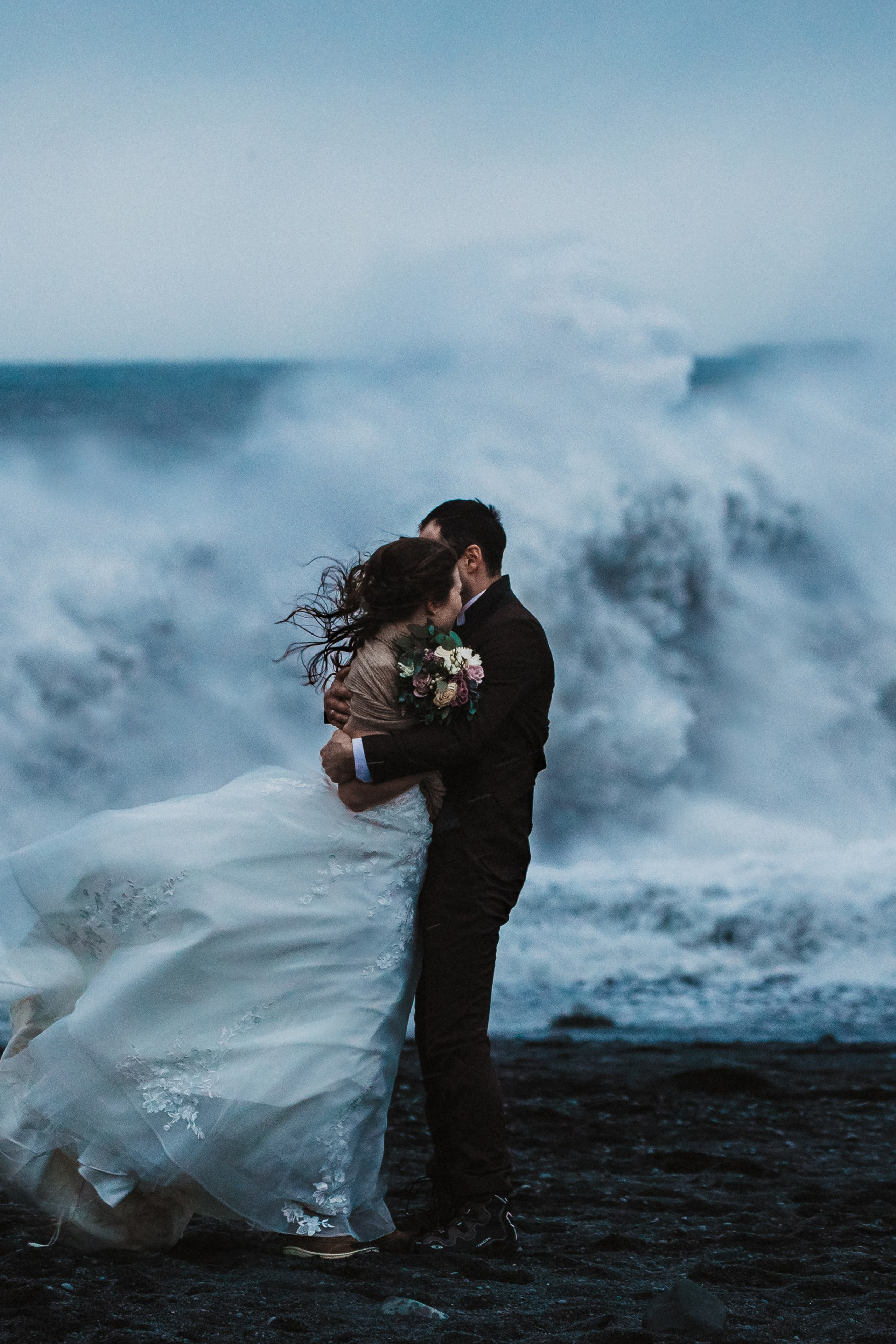 Winter elopement in Iceland | Stormy elopement at Black sand beach