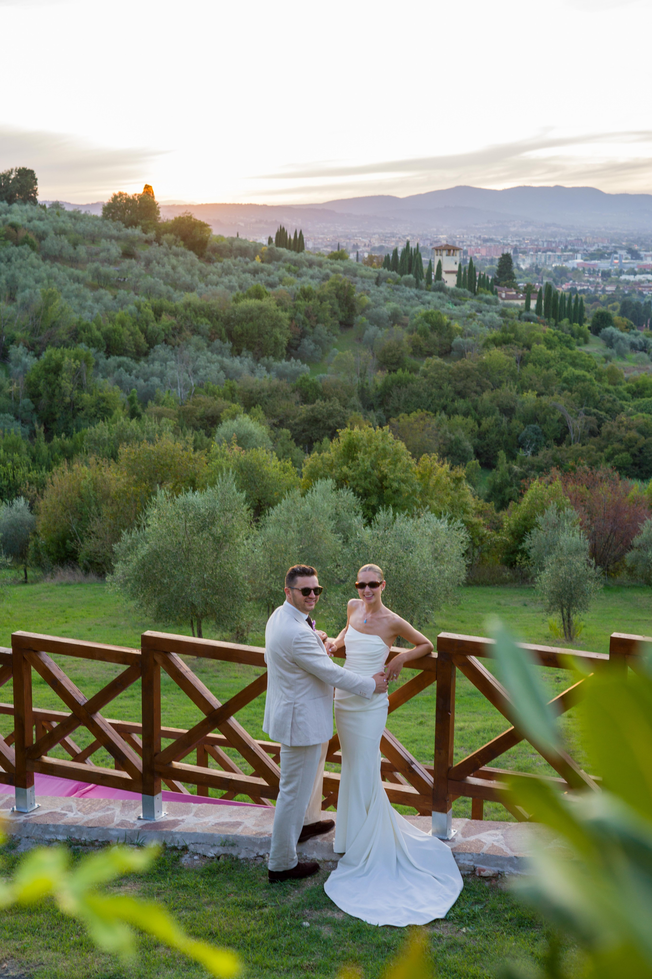 Bride and groom posing for wedding photos in Florence.