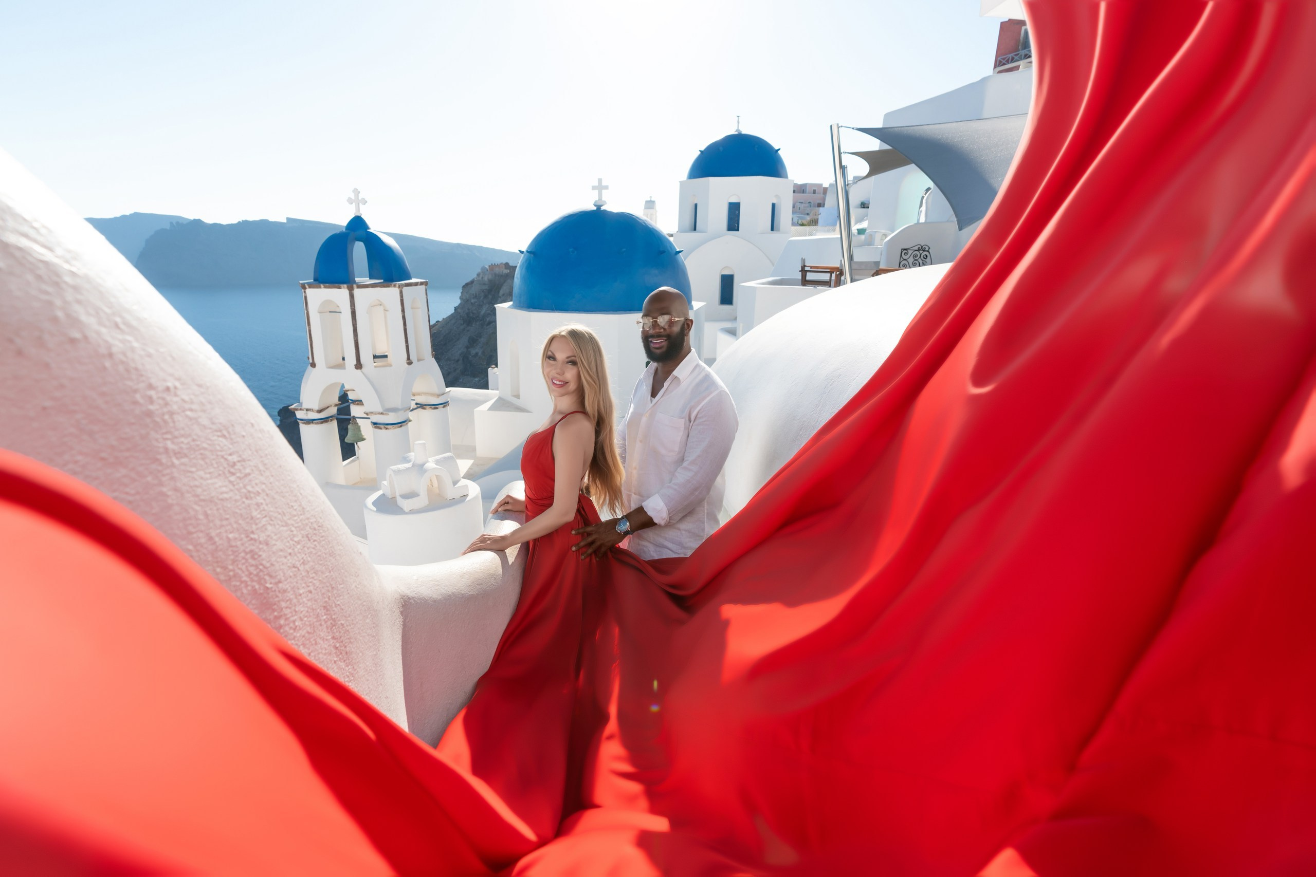 Ethereal Romance: A Breathtaking Flying Dress Photoshoot in Santorini
