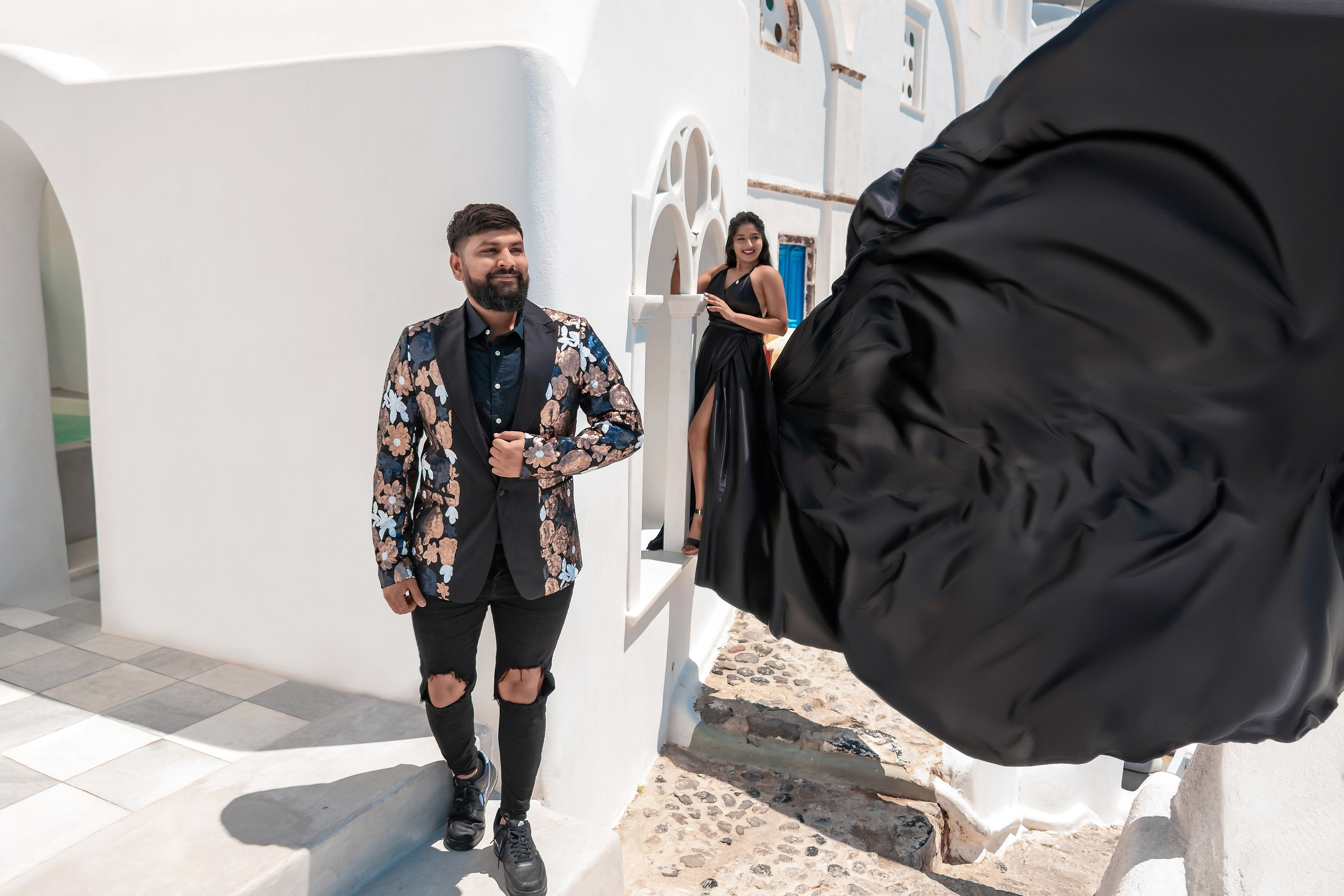 Elegance in Flight: The Black Dress that Soared Over Santorini