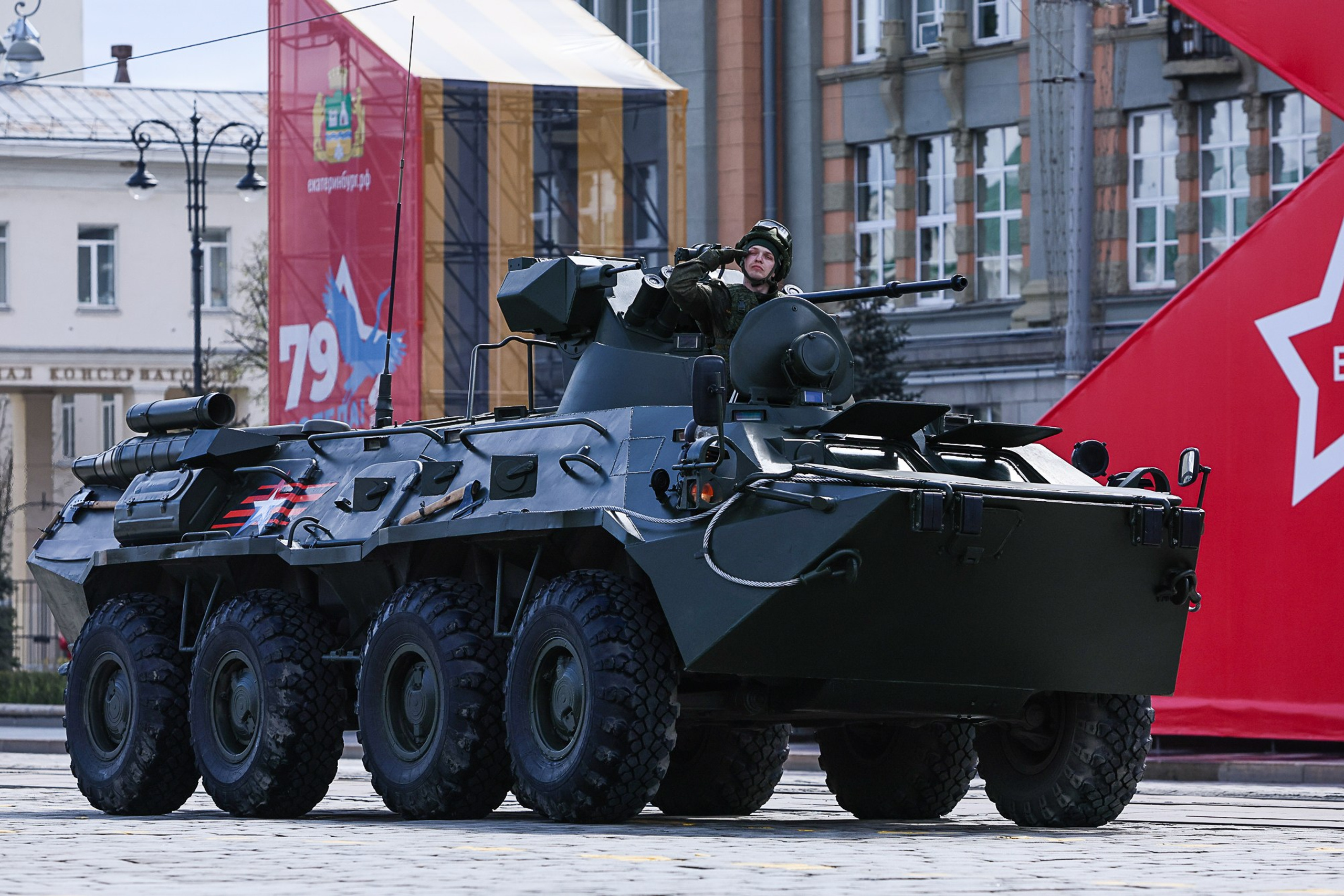 Military vehicles driving through square at Victory Day parade, Yekaterinburg 2024