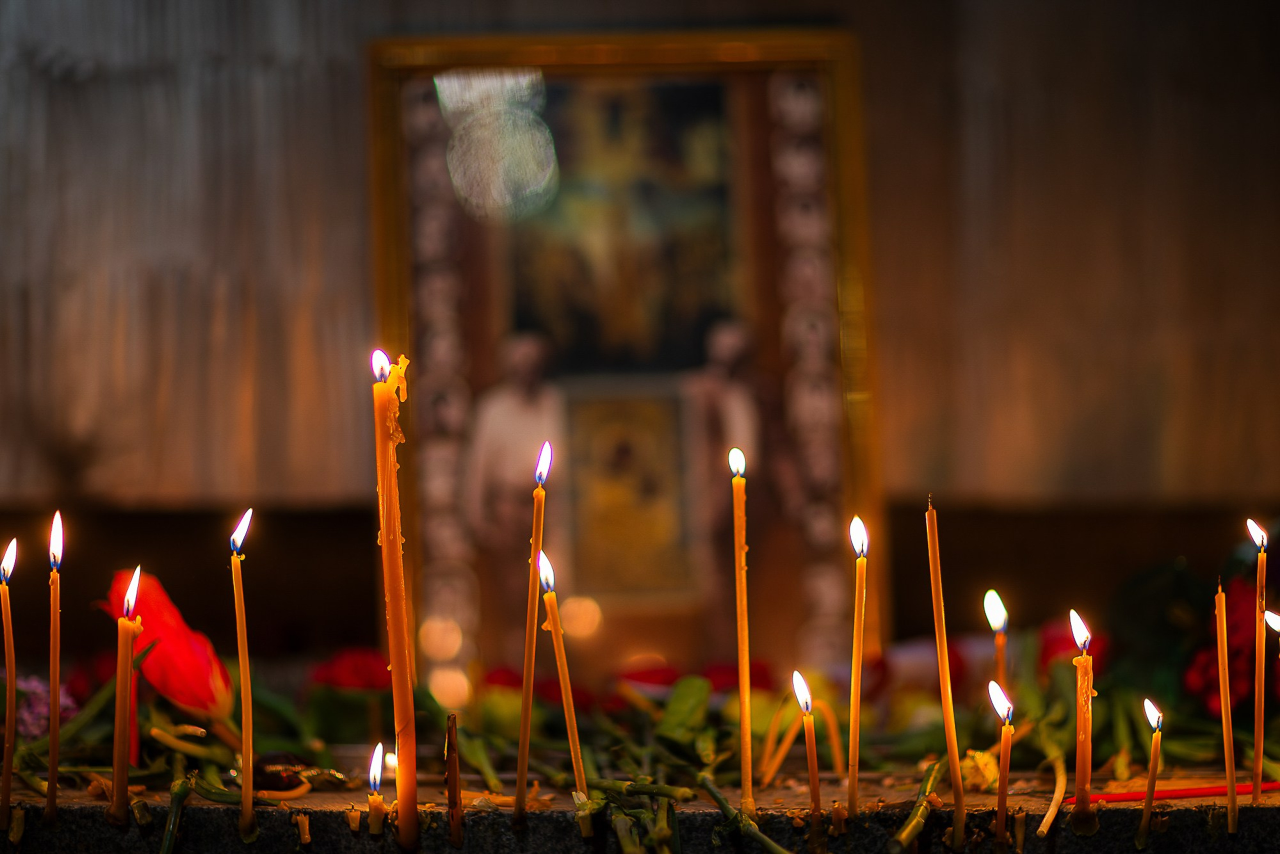 People with flowers and candles at April 9 memorial, Tbilisi 2025